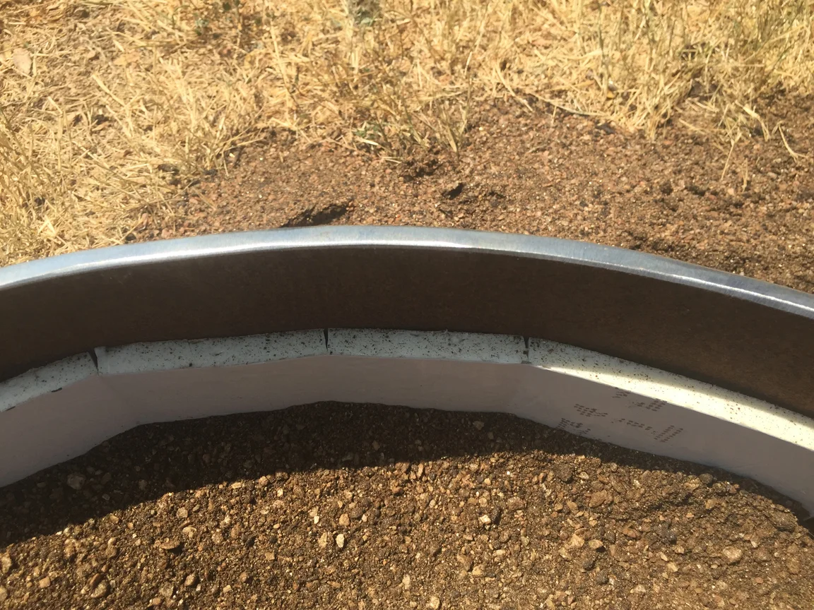rigid insulation between the soil and steel will help the plant roots from burning. this step is open skipped and the results are dead plants.