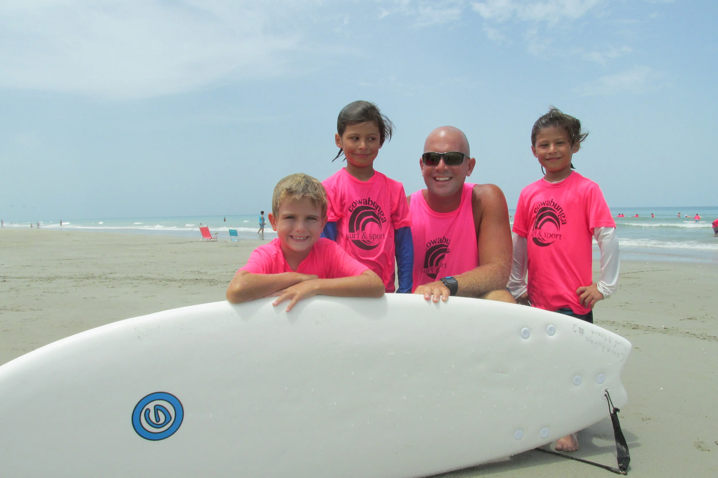 Brett Jenkins with Beginning Surfers at Jensen Beach