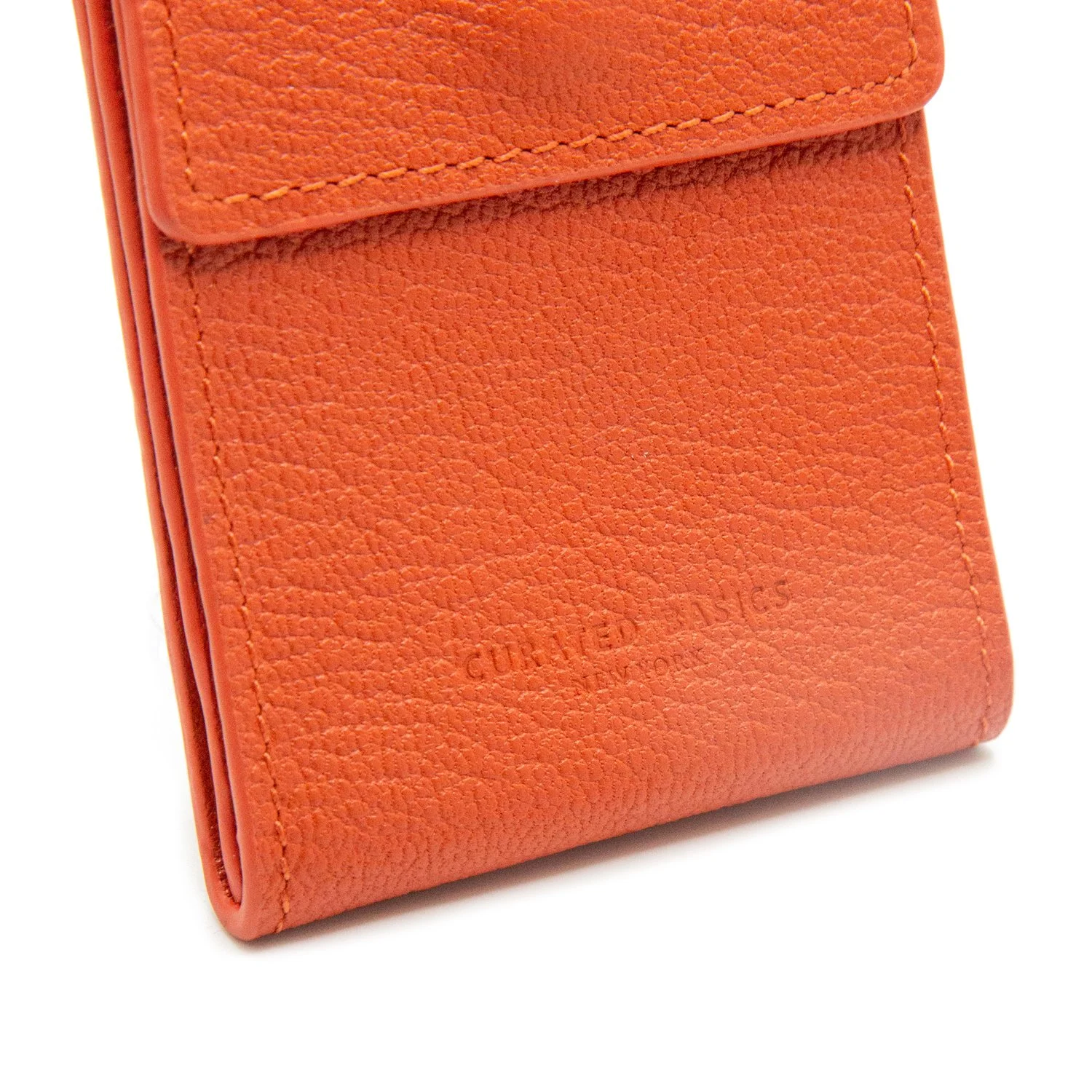 orange tri fold flip wallet in orange leather on white background
