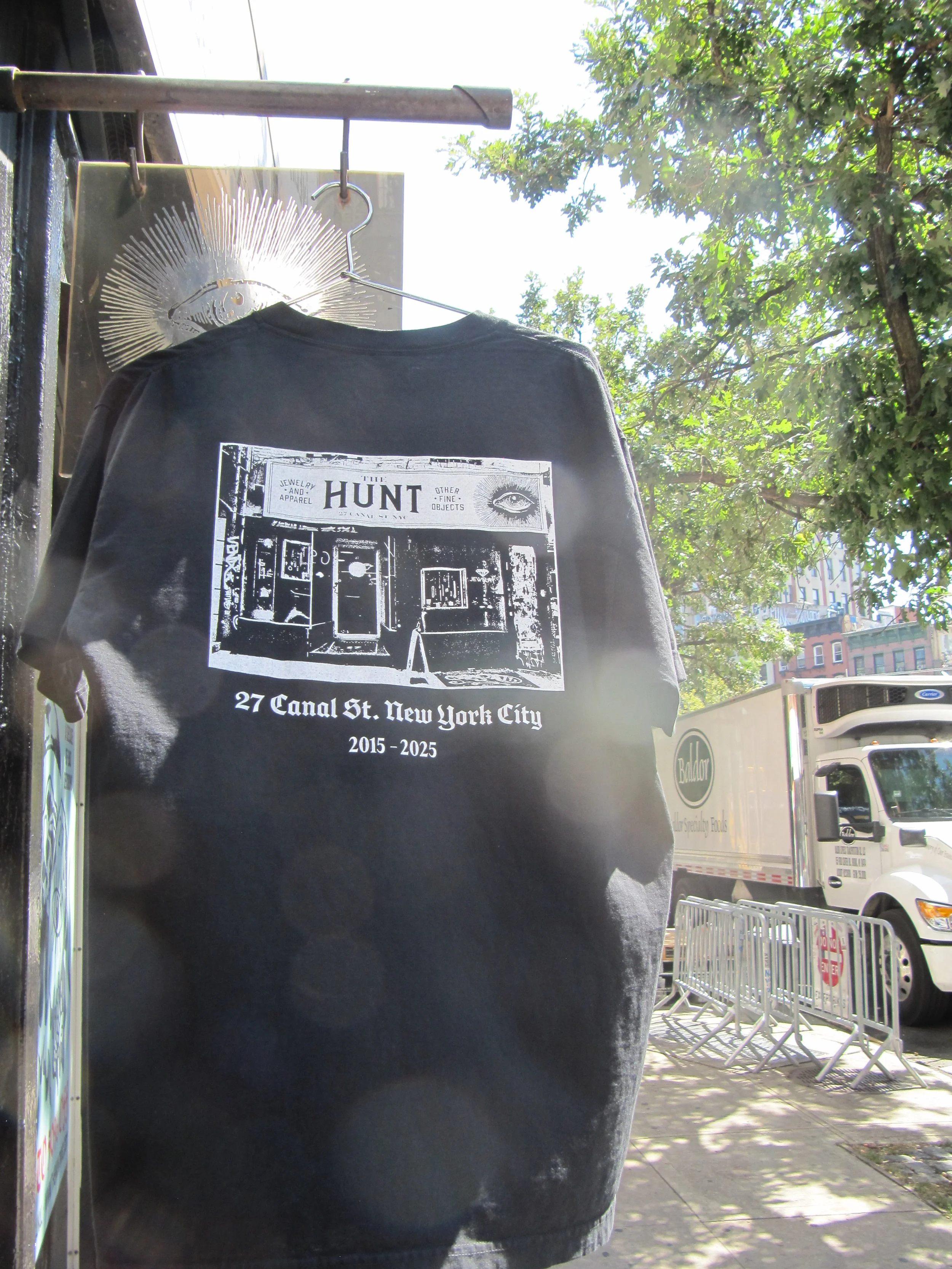 RIP T hanging in front of shop