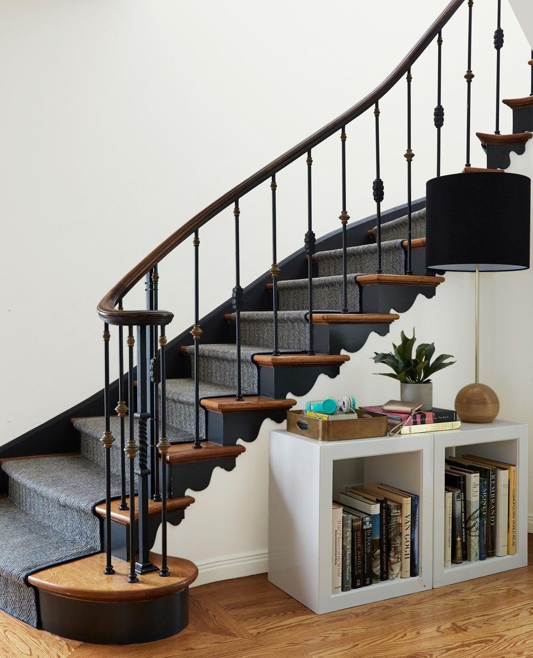 Painting the stair risers and baseboards in this San Francisco Edwardian highlighted the lyrical curves of the trim bringing new life to the stairway. Incorporating charcoal black paint into your home adds depth and highlights key architectural eleme
