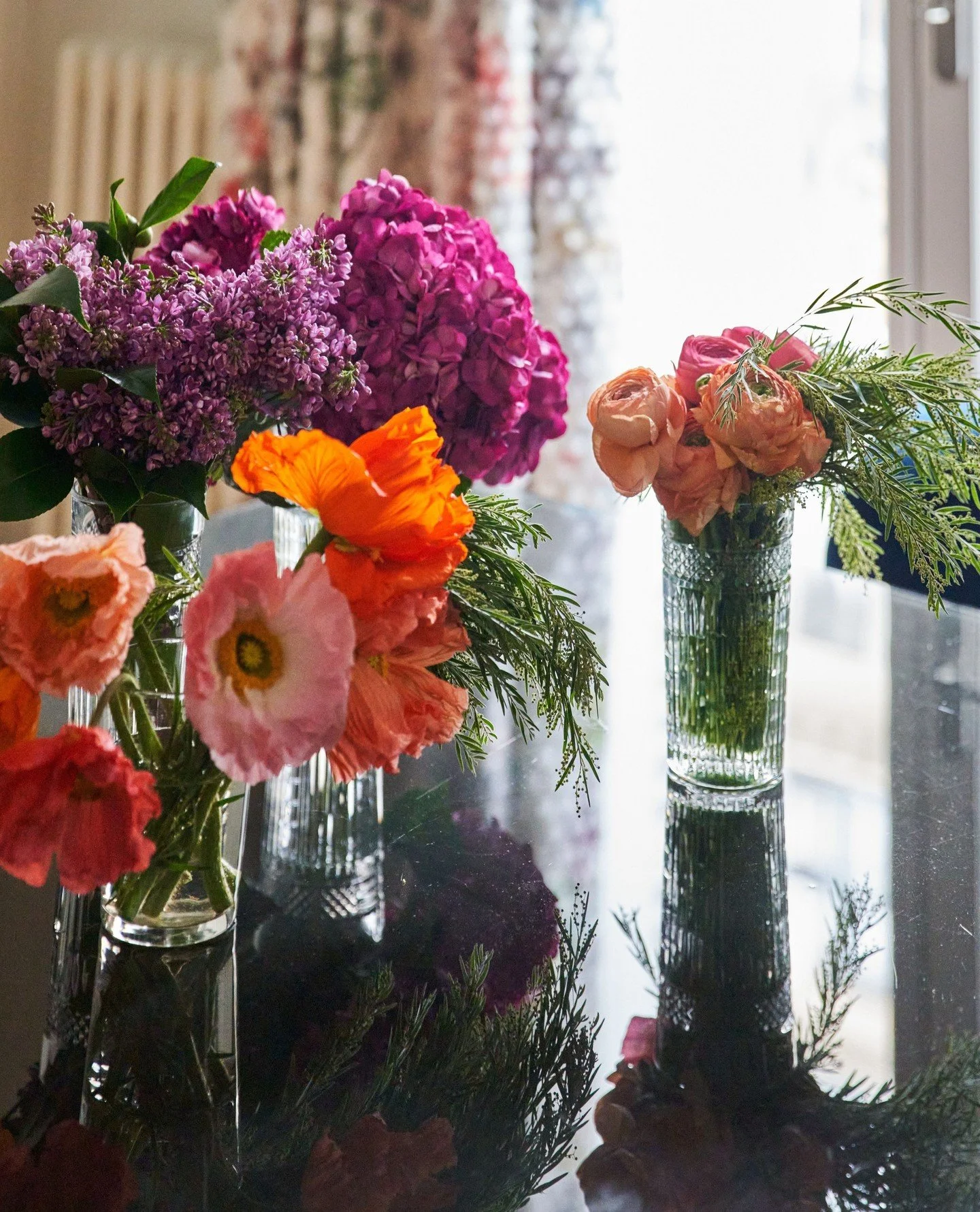 These multi-colored flower clusters, ring of balanced bulb globes, and shelves of vintage cameras, can only be made better by the fact that they are.... Parisian! ⁠
⁠
📸: @kuohphotography⁠ / as seen in March 2026 issue of @sanfrancisco.magazine @mode