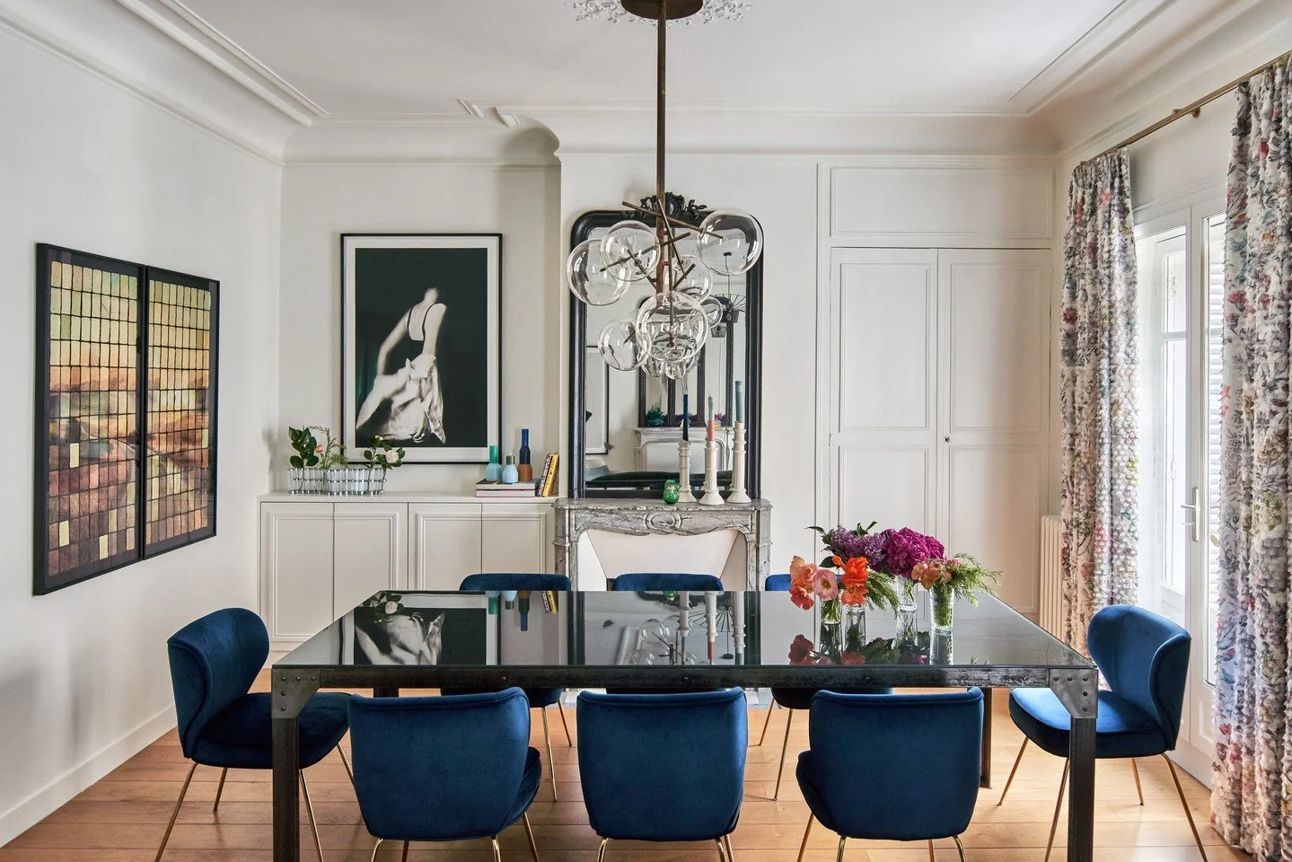 Years ago this Paris apartment was two separate units that were then thoughtfully combined.  The merging of the spaces created a dining/living great room flanked by facing fireplaces. Oh la la. ⁠
⁠
📸: @kuohphotography⁠ / coming soon in the May 2026 