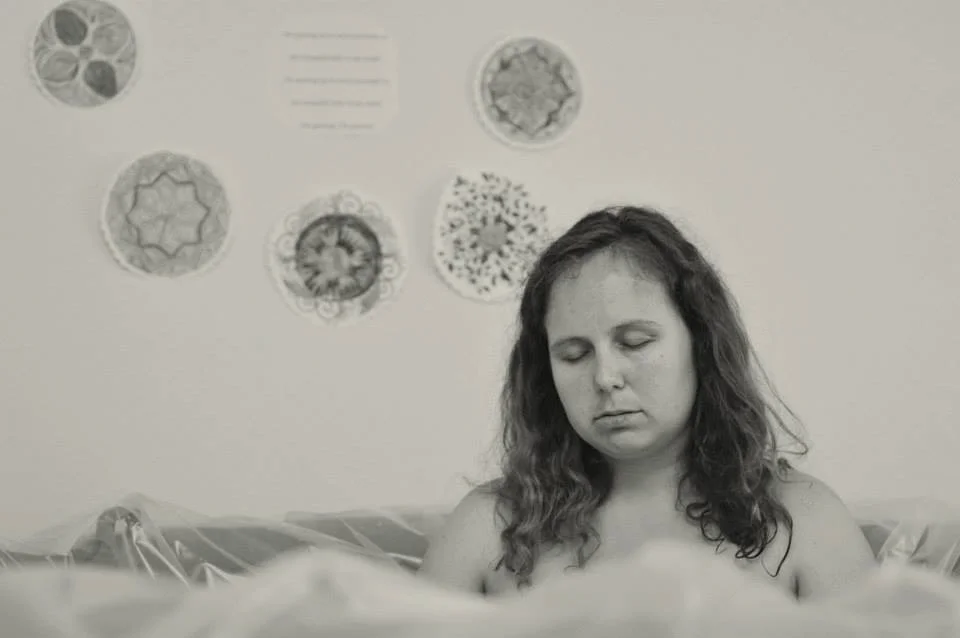 Sandra relaxing through labor in the birth pool moments before Seraphina was born image provided by Shanna Wright Photography