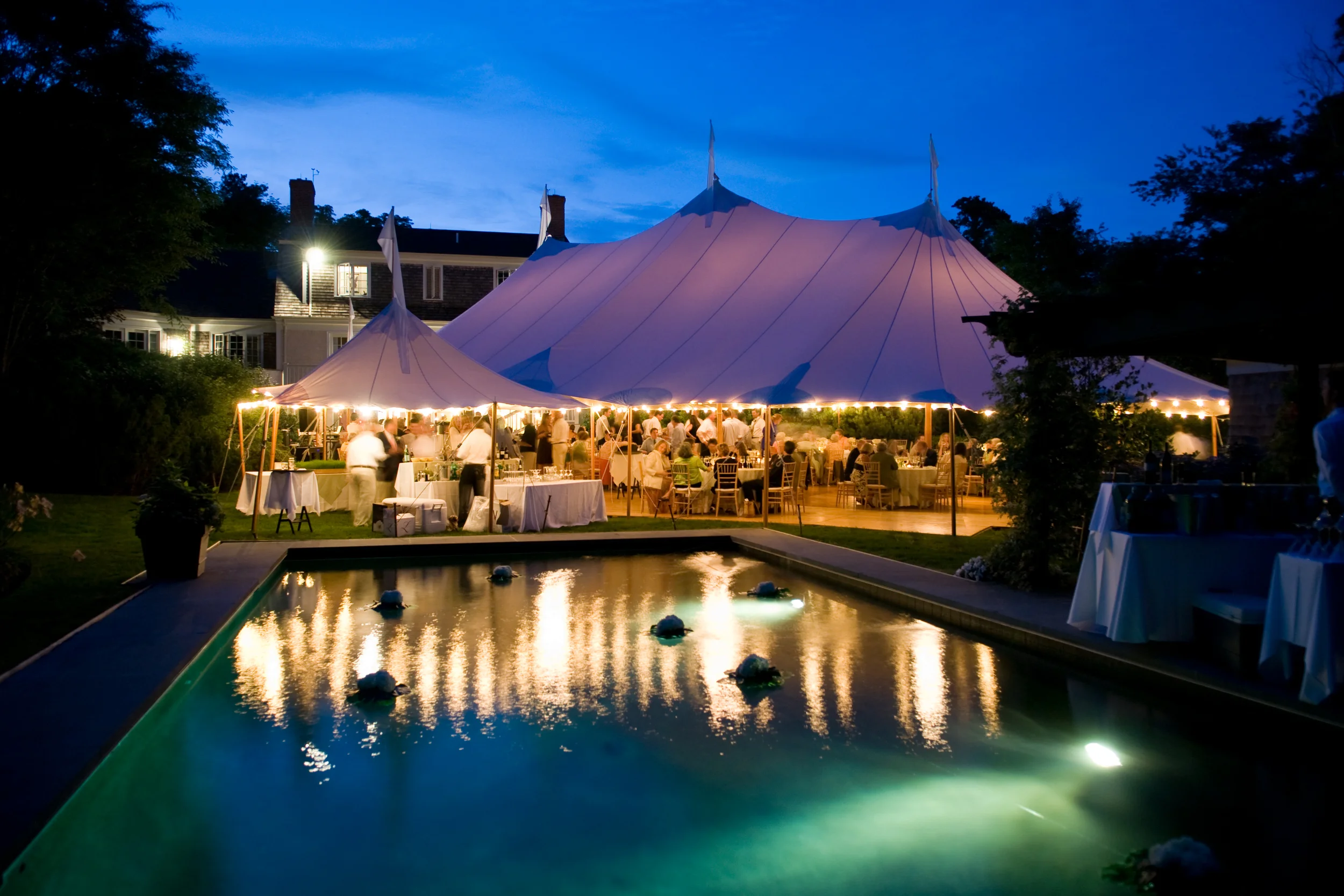 Sperry Tent over pool at backyard wedding