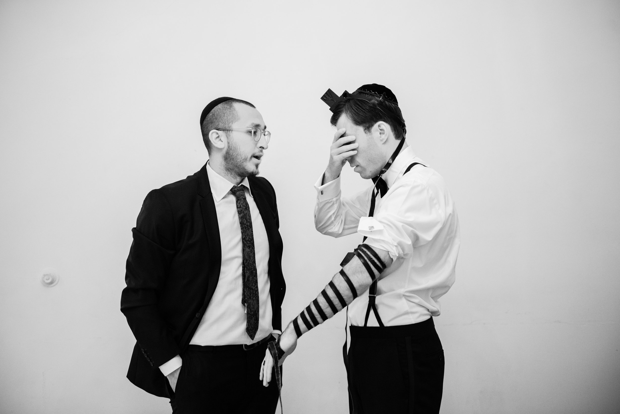 Jewish groom praying before ceremony