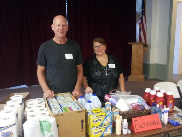 Rick and Amber at Baskets of Life Exchange Desk