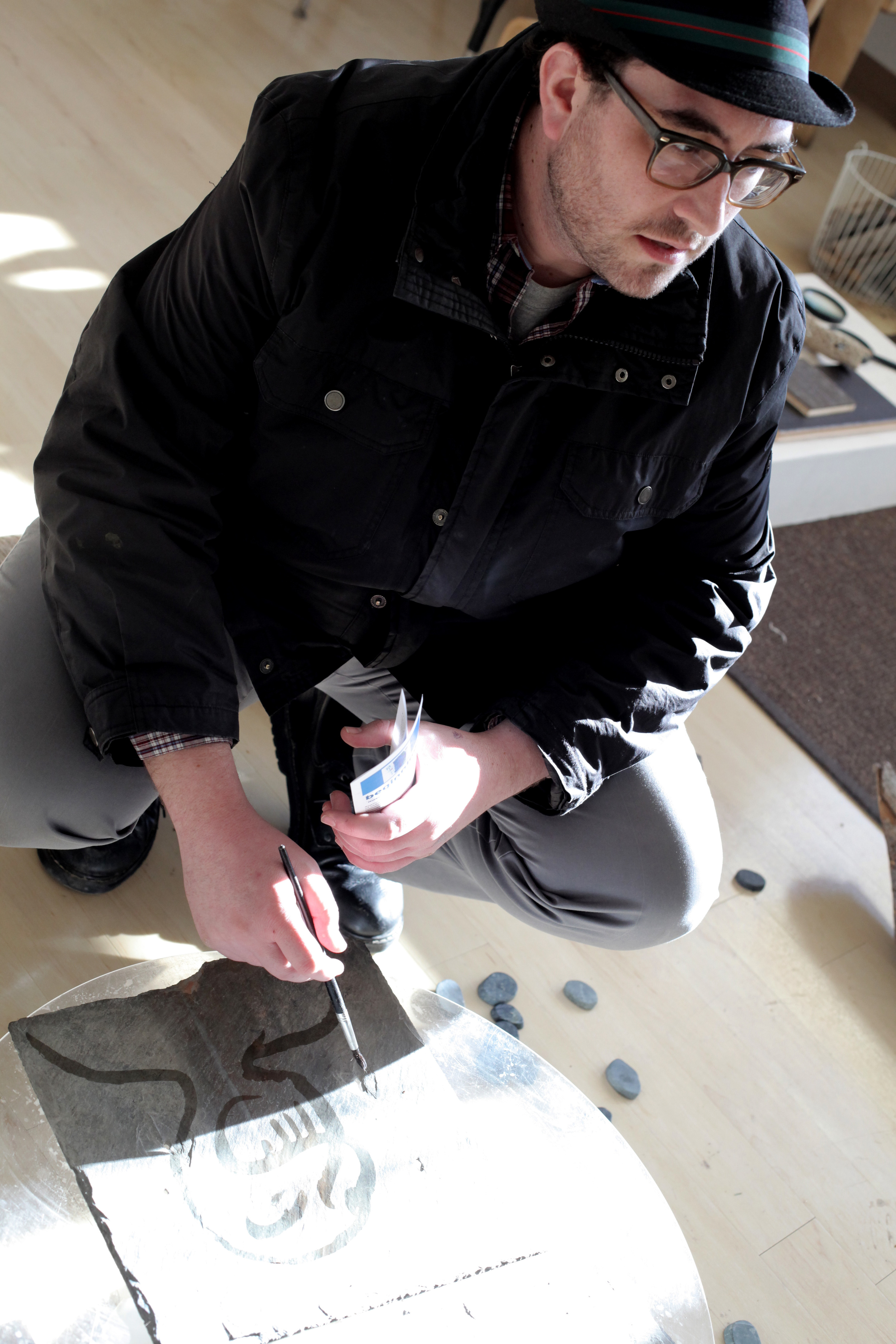Alex Long, PreK teacher, Spruce Street School (PS397, NY NY), paints with water on slate.