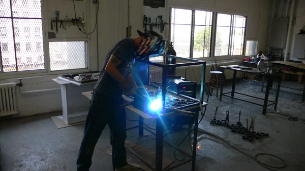 Denny working on one of the monitor stands
