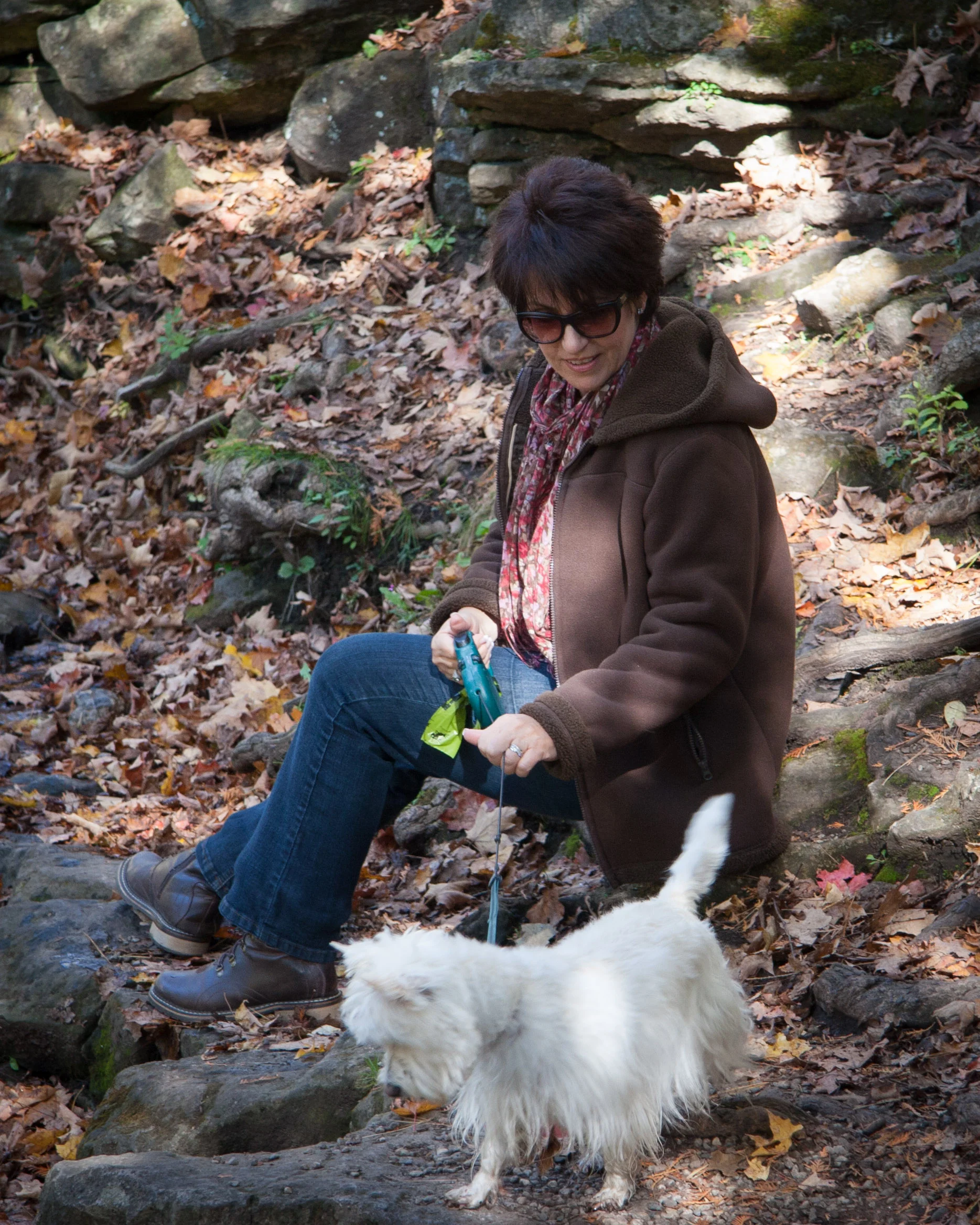 Heather is encouraging our Westie Morgan to go in for a drink. 