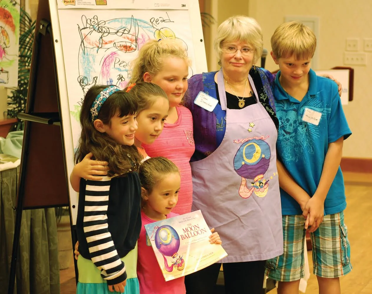 Photo of Joan Drescher and kids at a training of volunteers for Helping Children Cope Programs, a community outreach effort of The Friends of South Shore Hospital in Weymouth, MA.
