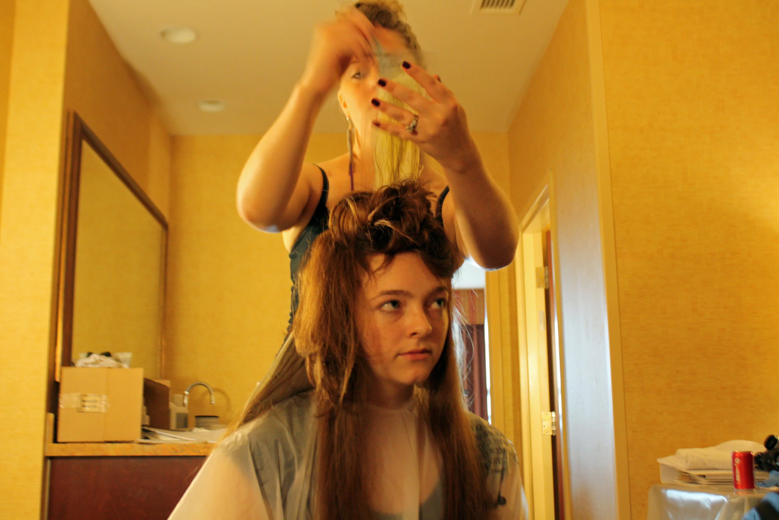  A stylist preps a model during the Prestidge Salon Products trunk show in Charlotte, North Carolina. 