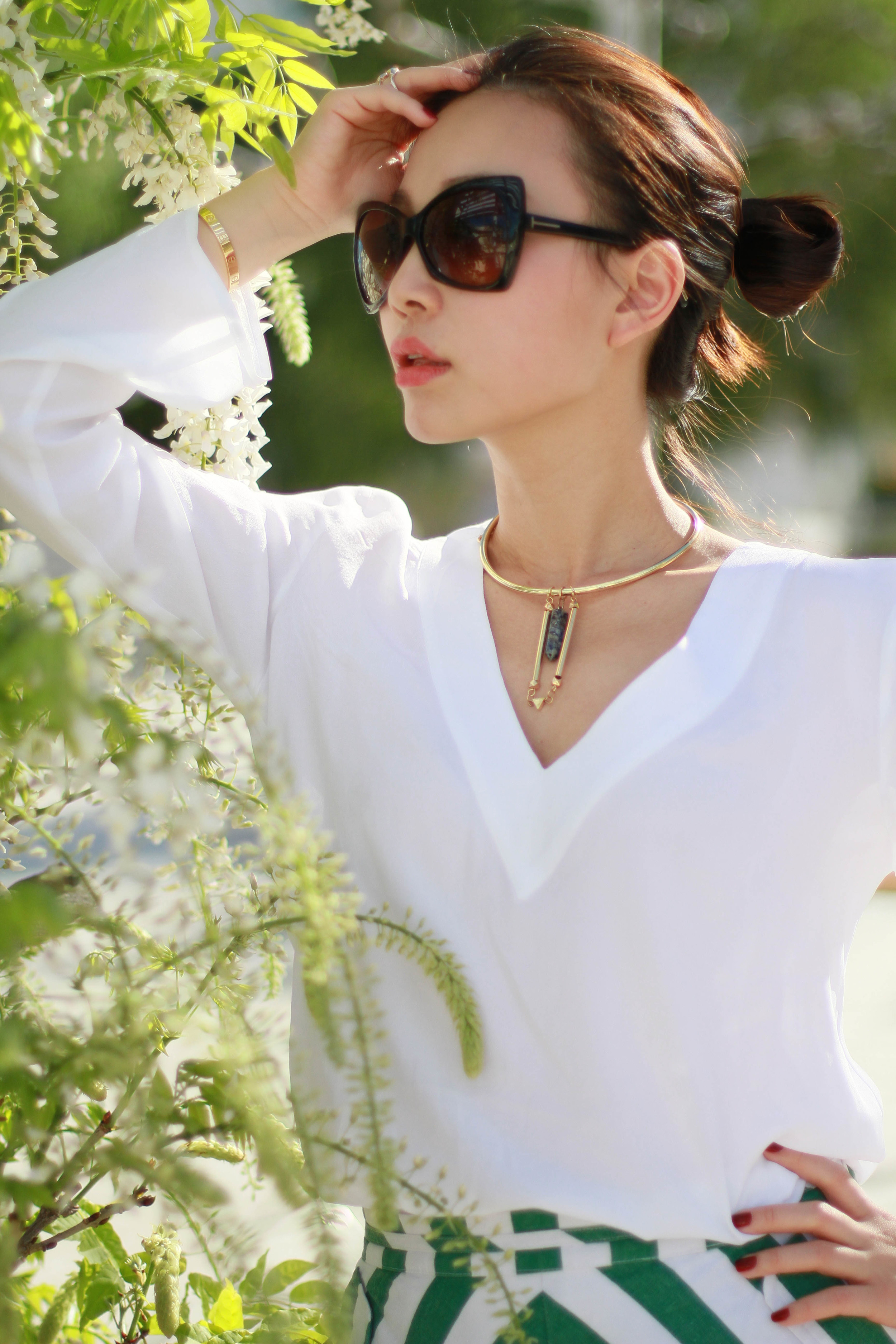 A simple pairing with a white blouse. When sporting the look, keep the accessories to a minimum.