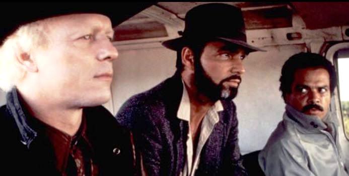 Dar Robinson, Burt Reynolds, and Jose Perez in STICK