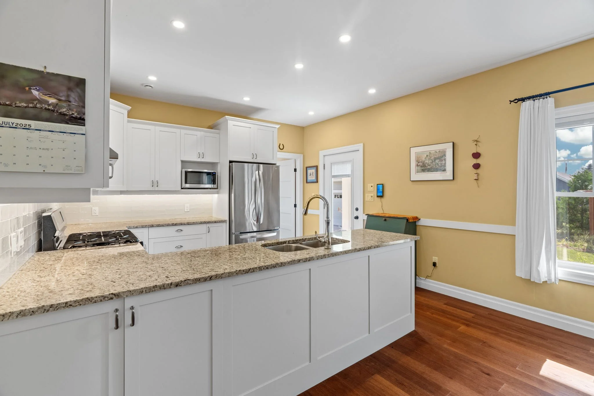 Kitchen features granite countertops