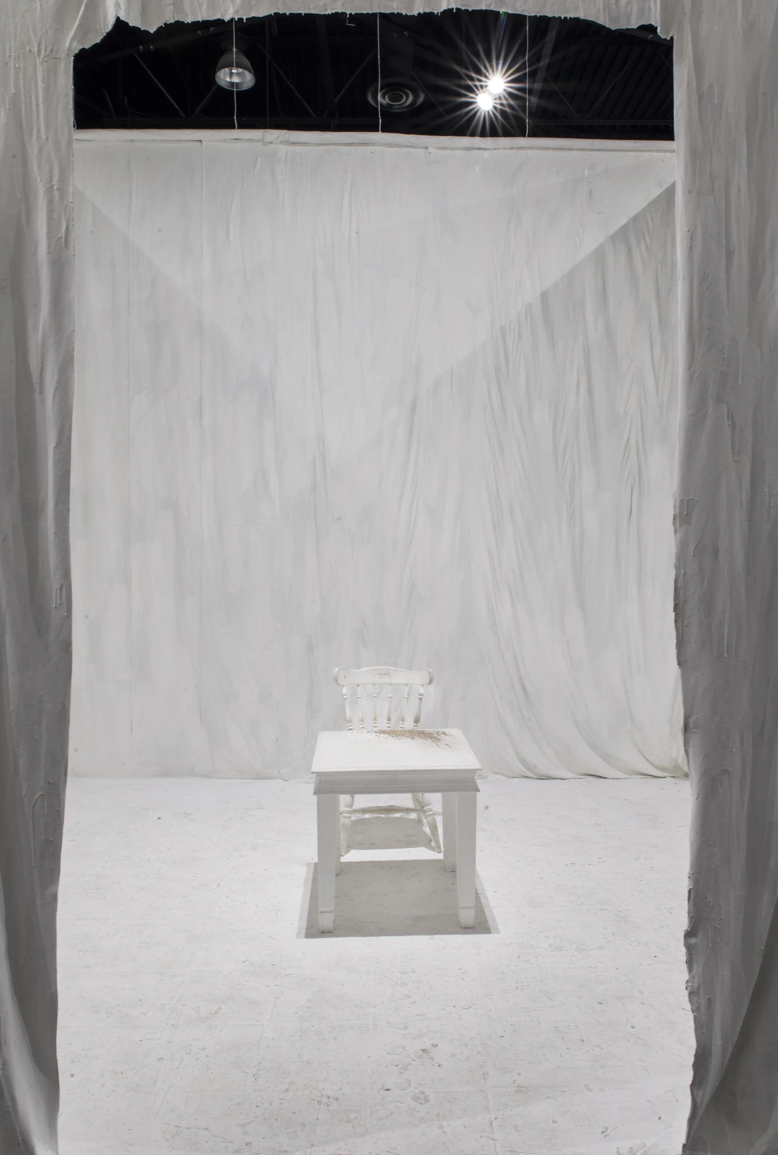  paintskin walls and floor, with wooden table and chair, 144"x100"x100"  2015  photo credit:&nbsp;stephen takacs 