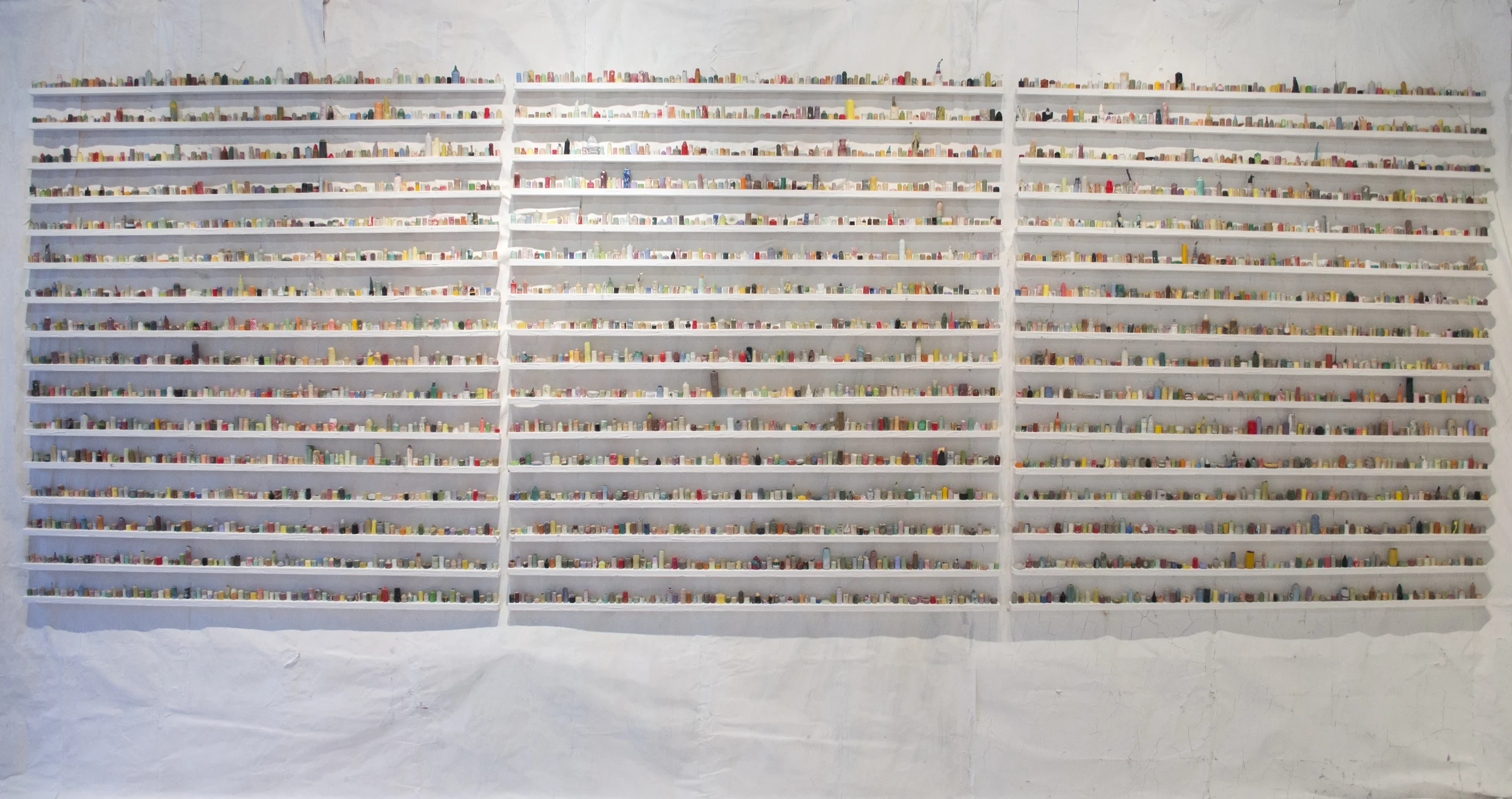  paintskins on wooden shelves, paintskin on wall and floor  2015 