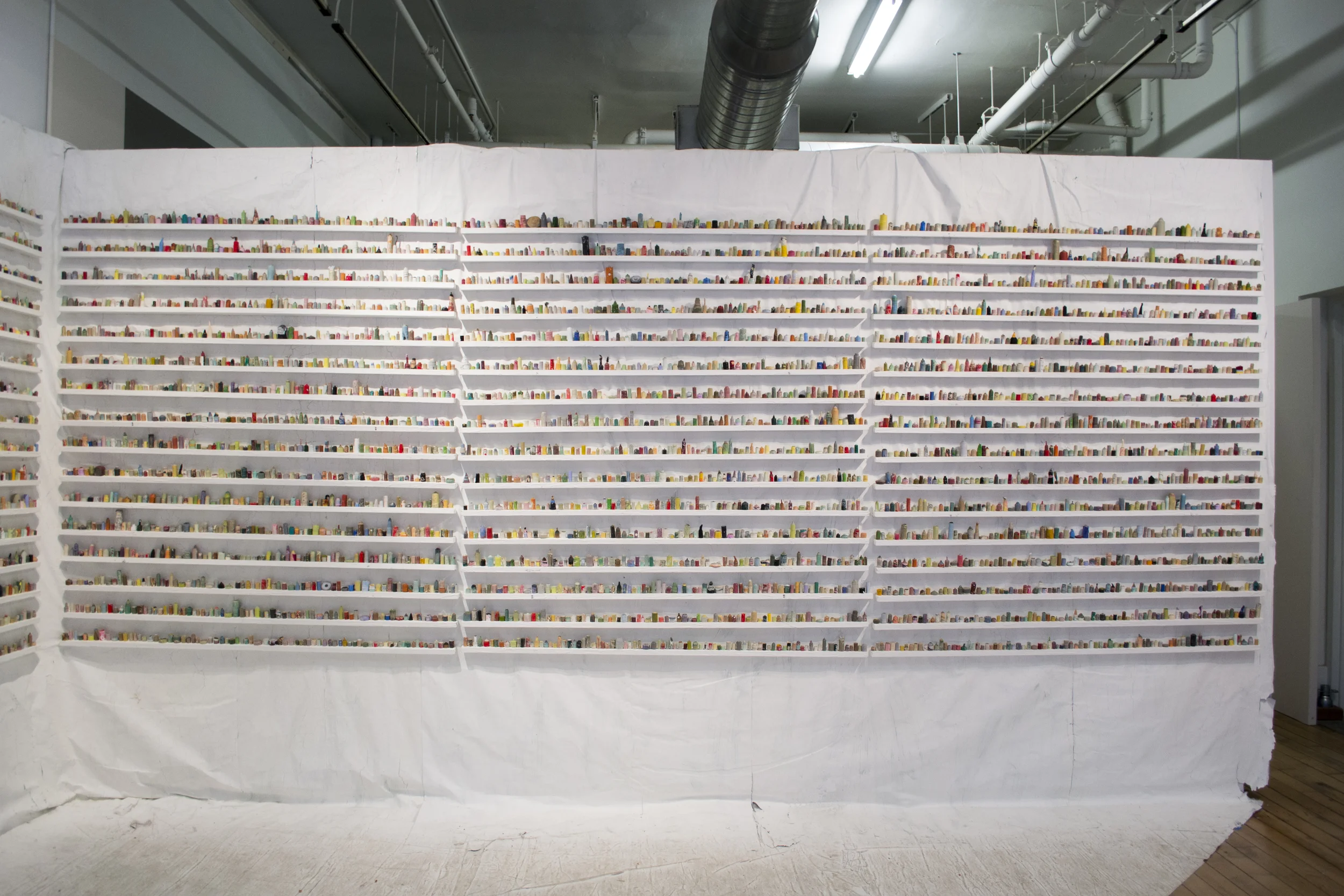  paintskins on wooden shelves, paintskin on wall and floor  2015 