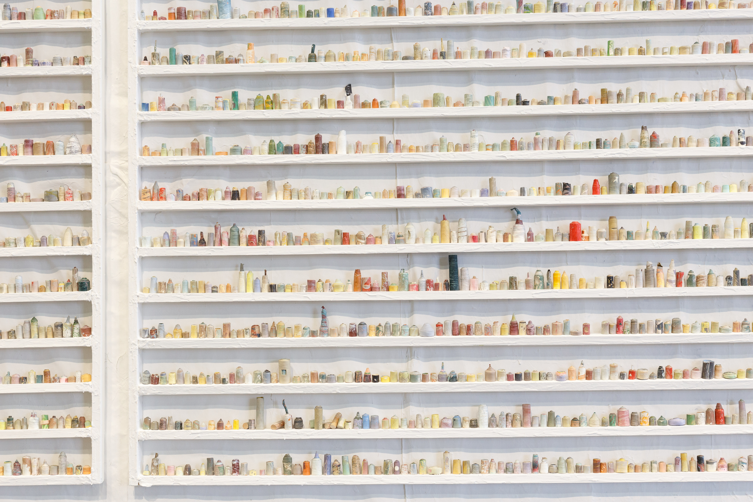  paintskins on wooden shelves, paintskin on wall   photo credit: tamrin ingram  