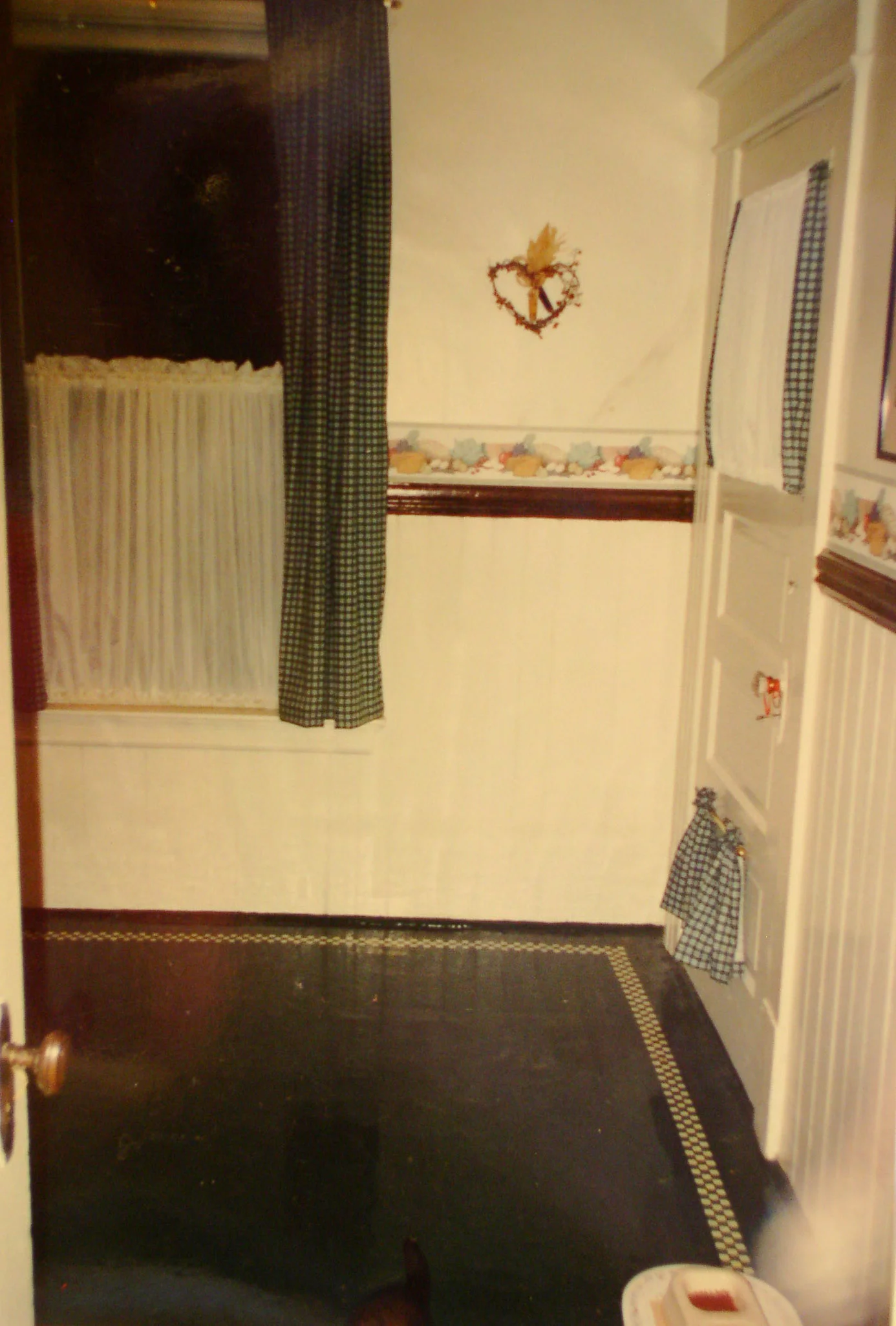 The window became the door and the porch door was removed to make room for the counter and cabinets.