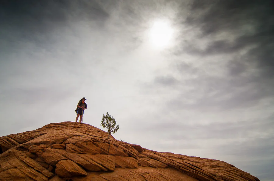 Lindsay navigating across the slick rock.