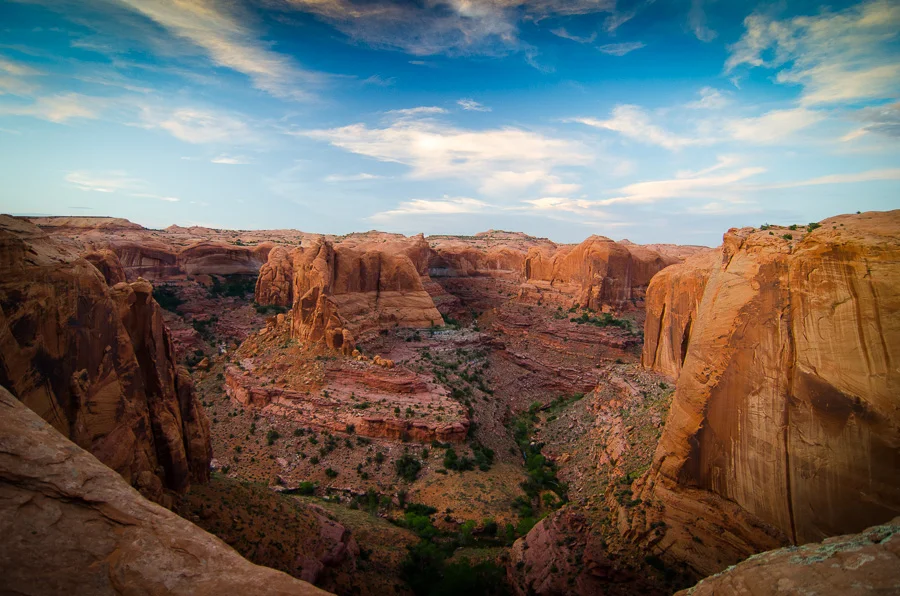 Two long days of crossing slick rock under the desert sun, ever conscious of the risk of running out of water, was rewarded with this sunset over Fool's Canyon. The Escalante River is a tributary to Lake Powell.