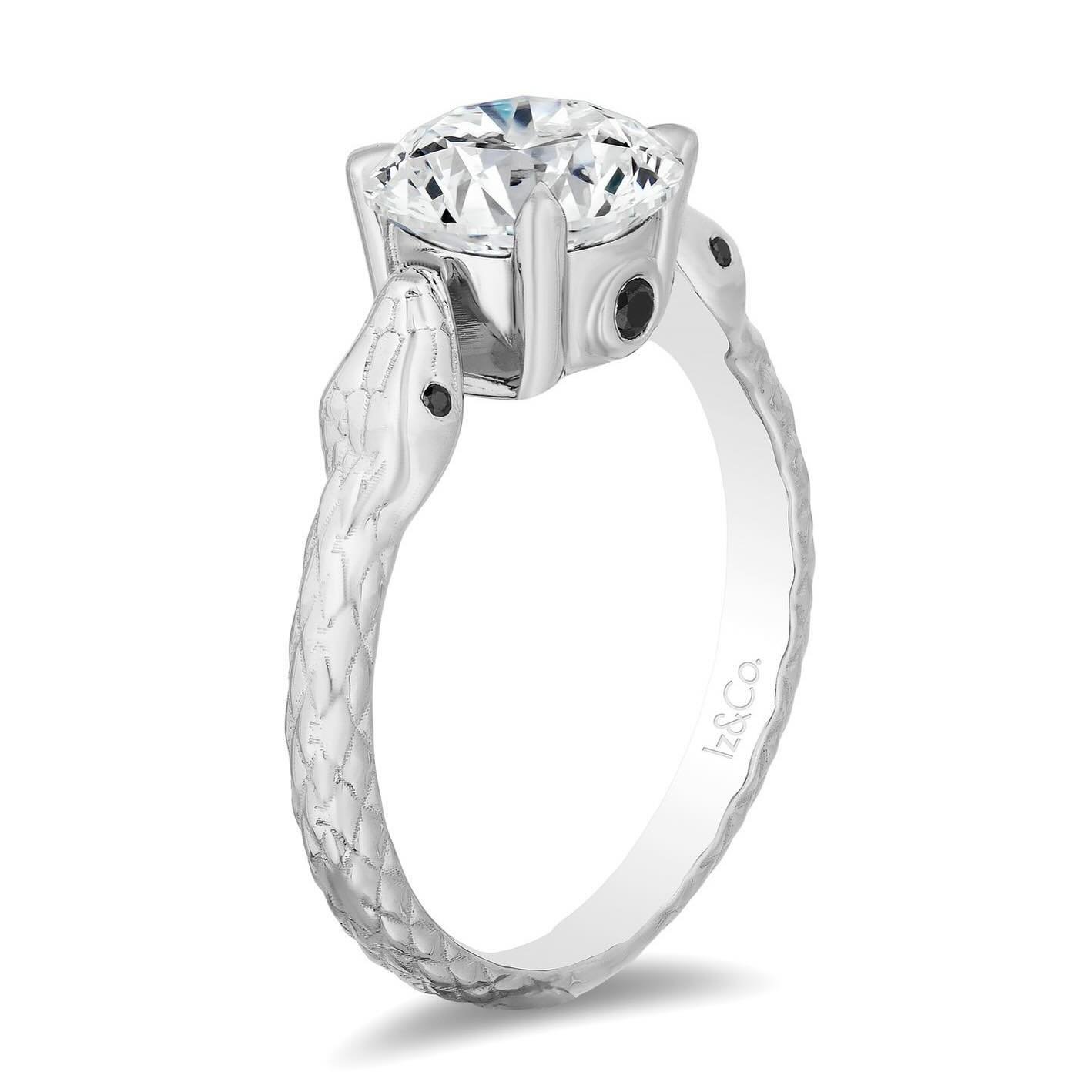 Captivate her with a touch of mystique. Introducing our stunning serpent diamond engagement ring &ndash; a symbol of eternal love and endless allure. Crafted with exquisite detail, this unique ring intertwines elegance and edginess that will make a s