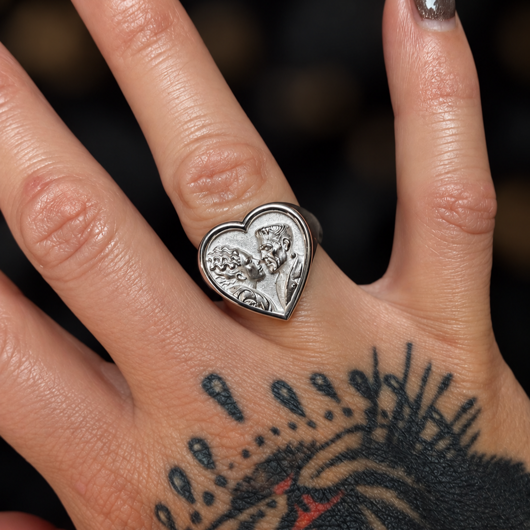 Heart+Relic+Ring+and+Tattooed+Hand.png