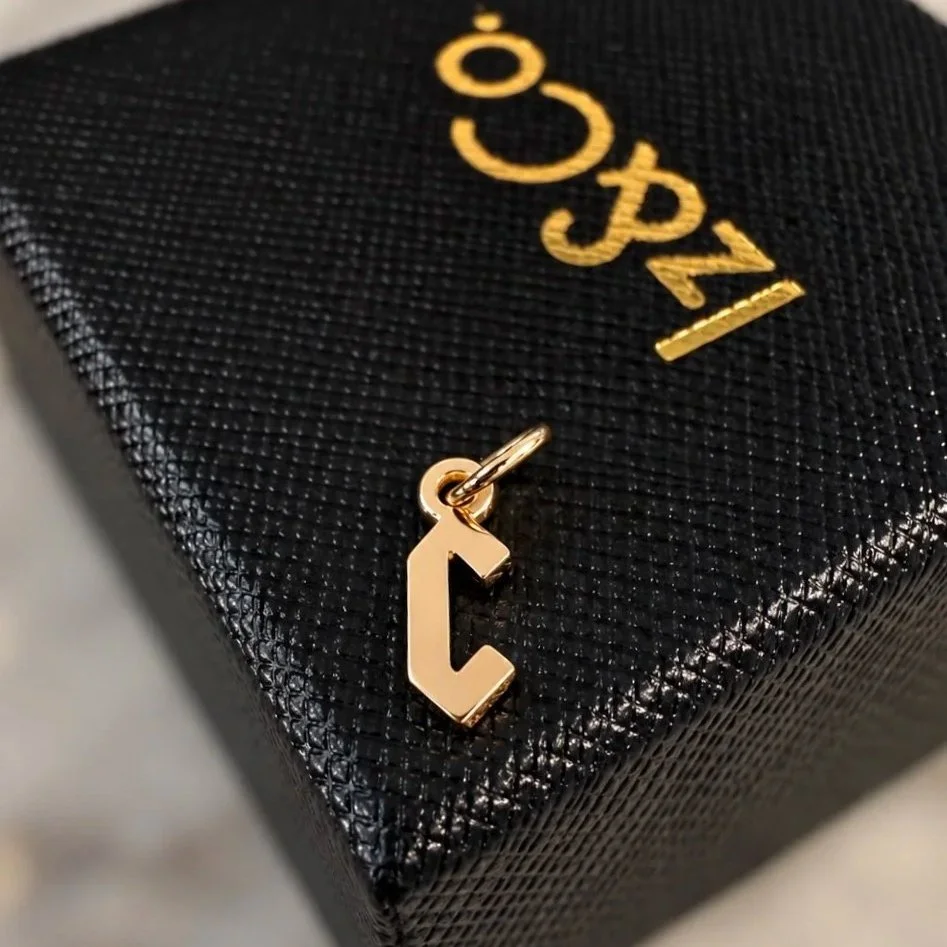 Gold+Geometric+Charm+on+Textured+Box.jpg