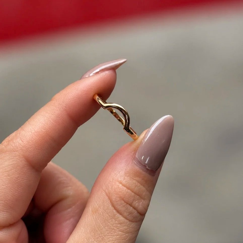 Delicate+Gold+Wave+Ring+in+Hand.jpg