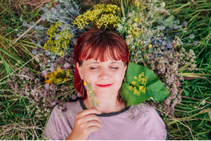 yoga workshop at ahimsa yoga studio katie sayad woman lying in a field of fieldflowers