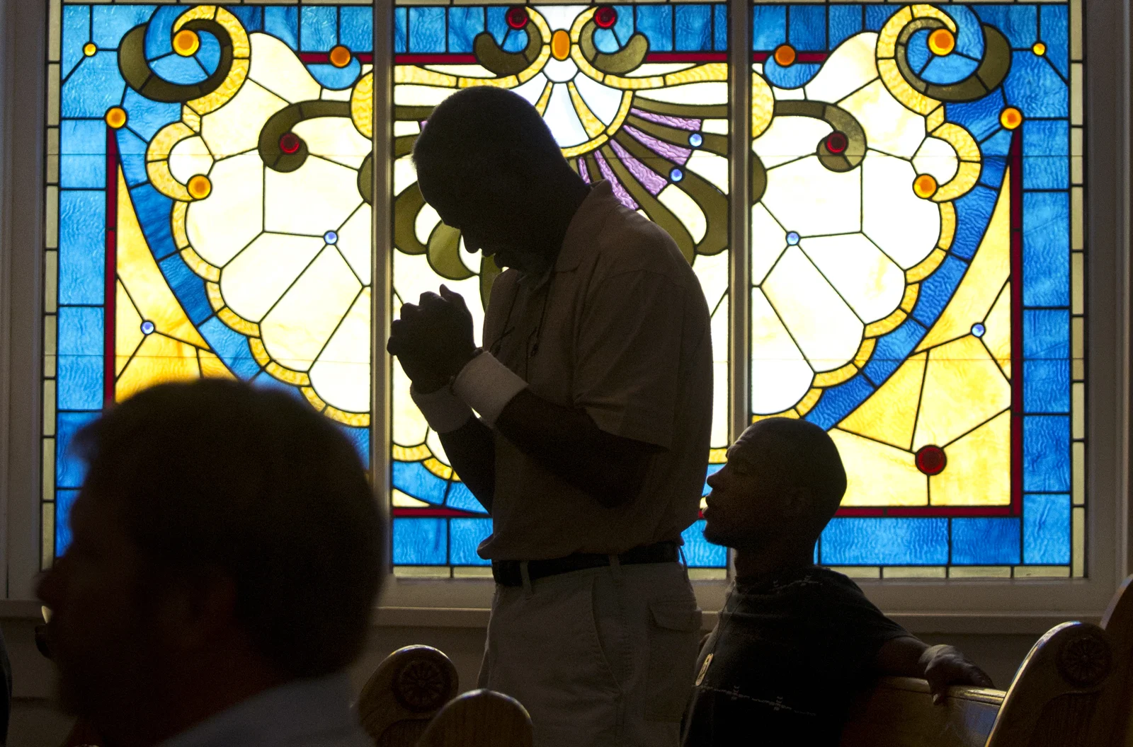 George Wilson stands while the choir sings "How Great Thou Art" Sunday, July 14 2013 at First AME Church in Pueblo, Colorado. 