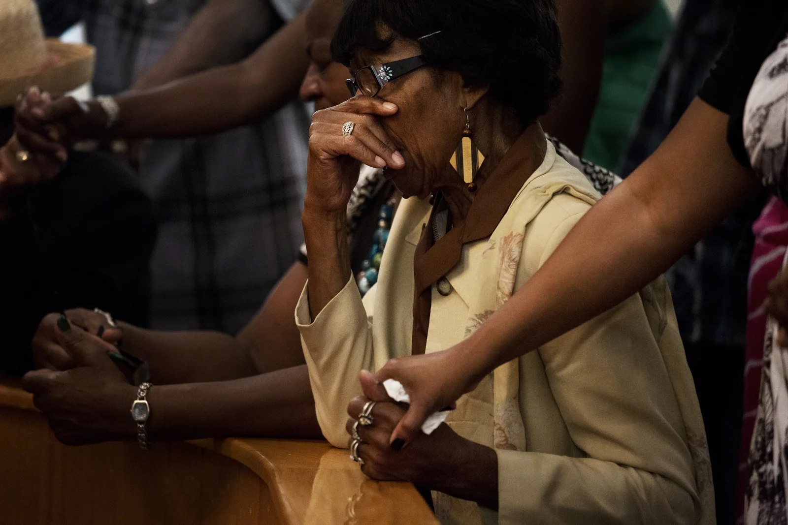 Members of the First AME congregation gather at the alter after Reverend Margaret Redmond's sermon concerning the George Zimmerman trial Sunday, July 14 2013. 