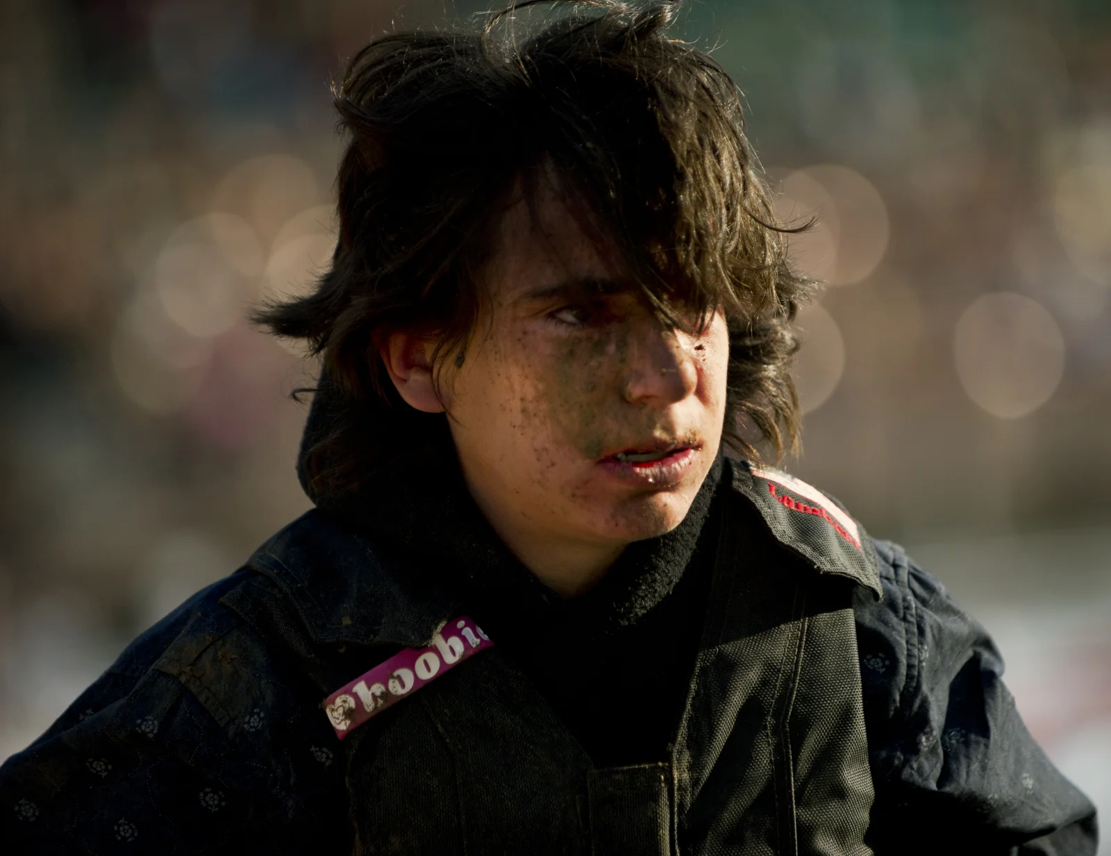 Justin Mire walks back to the edge of the arena after falling off his bronc Friday, July 26 2013 at the Pueblo State Fairgrounds. 