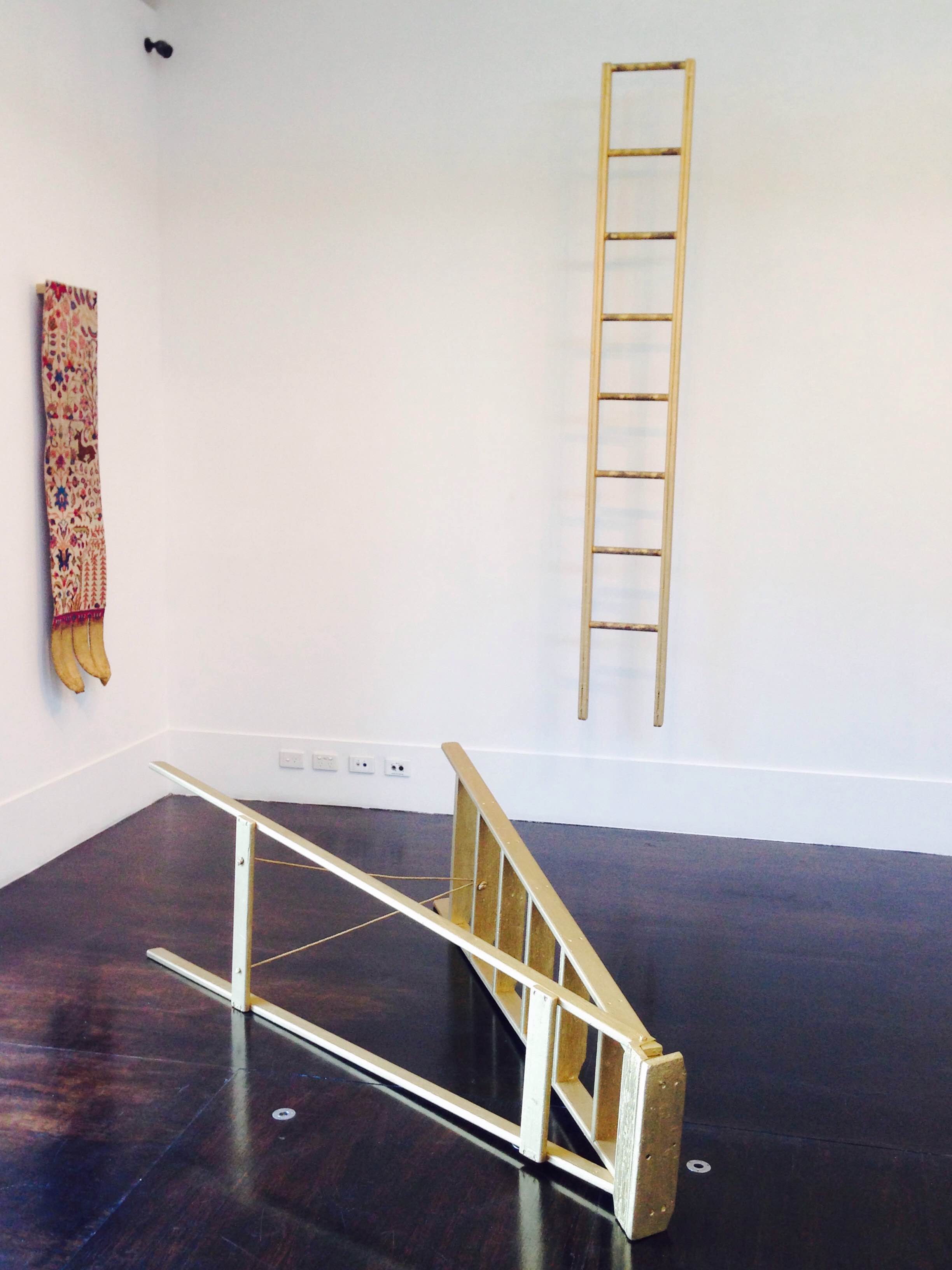 Image: Queer Bloodlines (After Orjis) , 2015, timber ladders, altered Persian carpet, gold acrylic, rose water, dimensions variable.