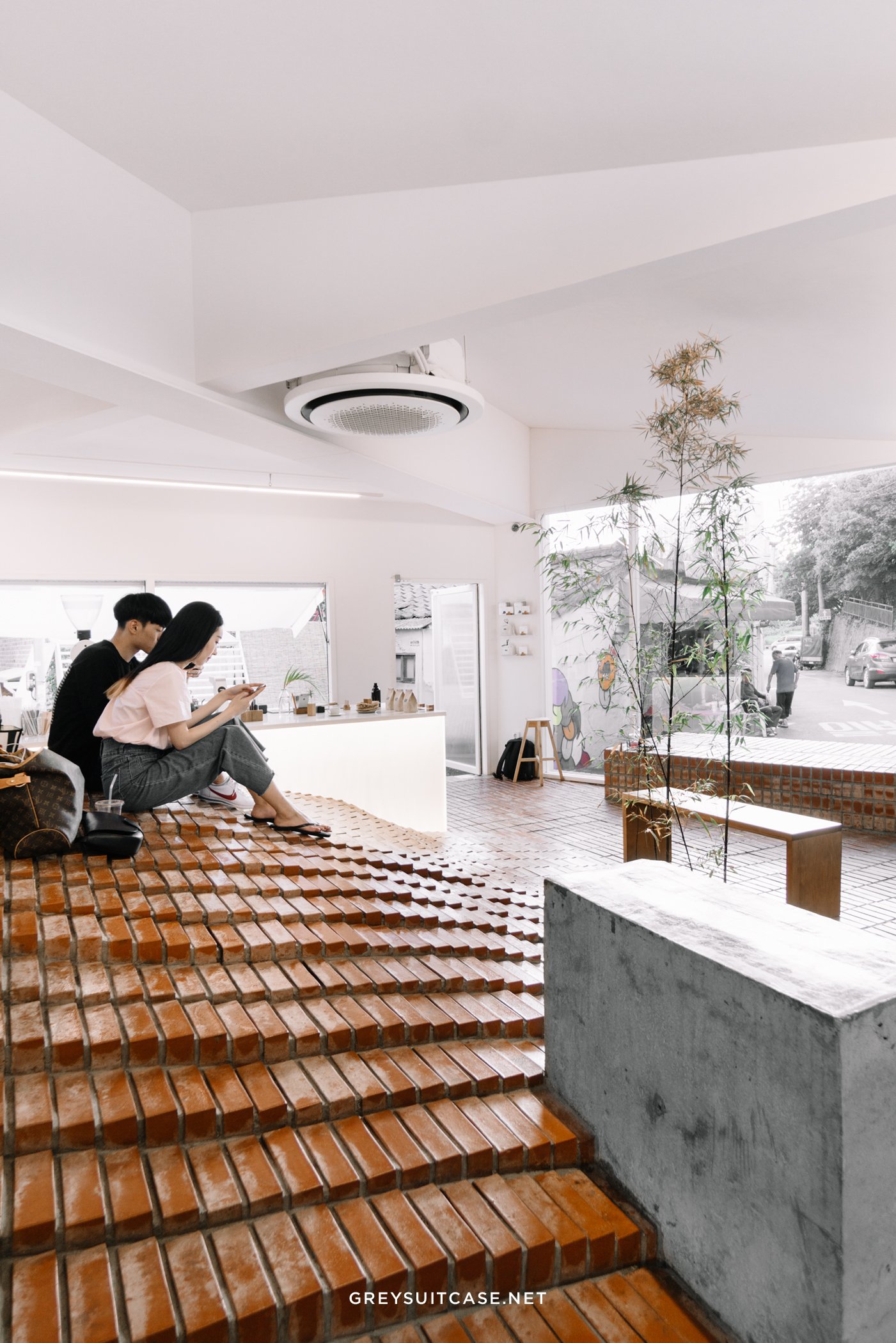 studio maoom replaces standard seating with a 7,000-brick hill in seoul's  coffee nap roasters