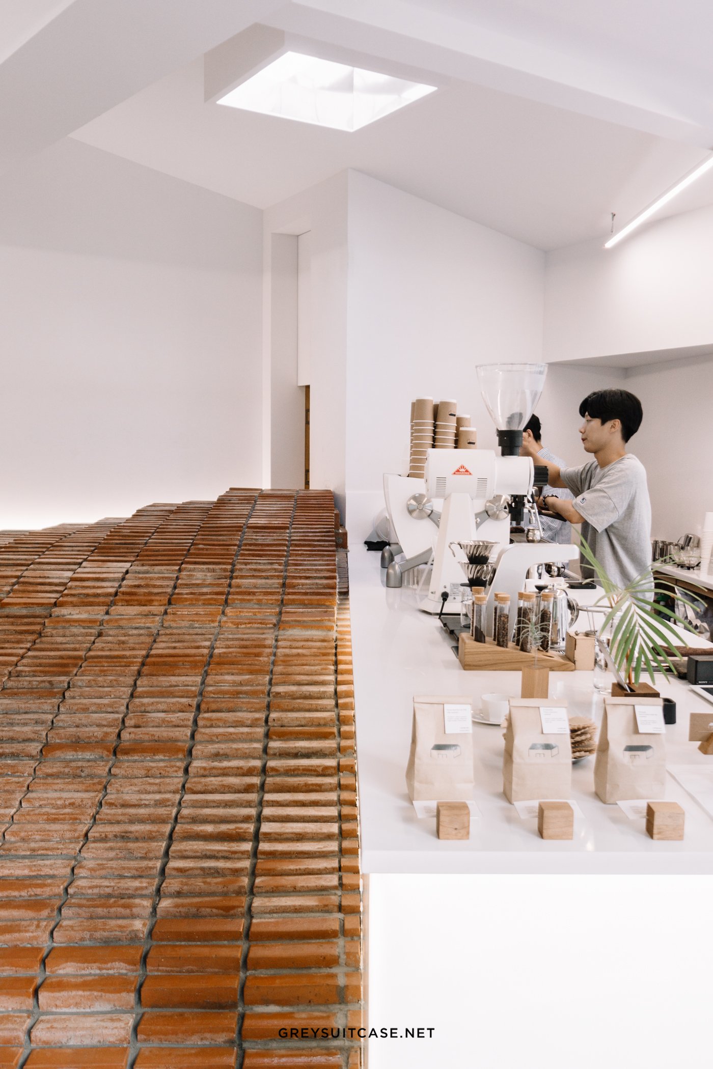 studio maoom replaces standard seating with a 7,000-brick hill in seoul's  coffee nap roasters