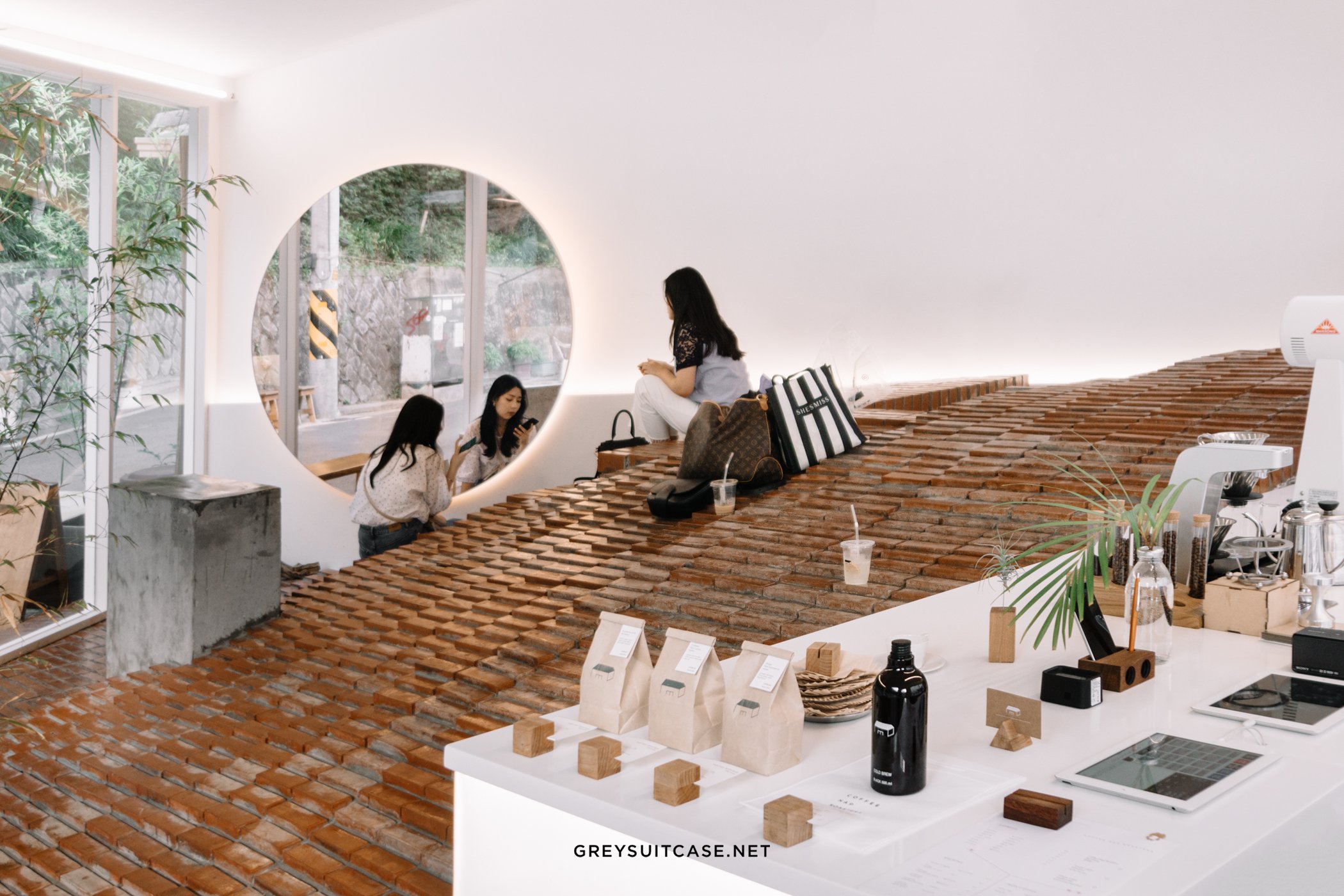 studio maoom replaces standard seating with a 7,000-brick hill in seoul's  coffee nap roasters