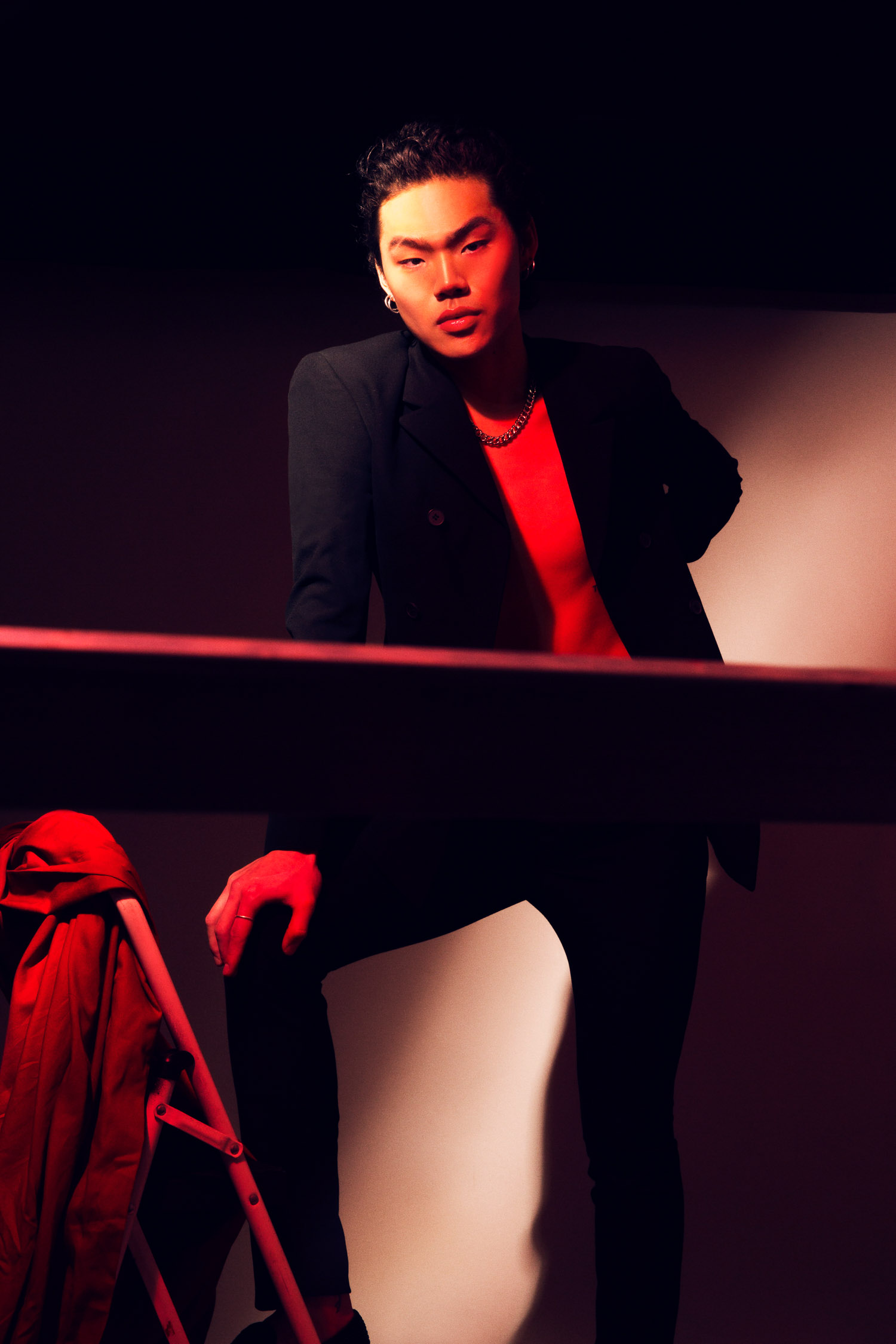 Portrait of an asian model in red light.