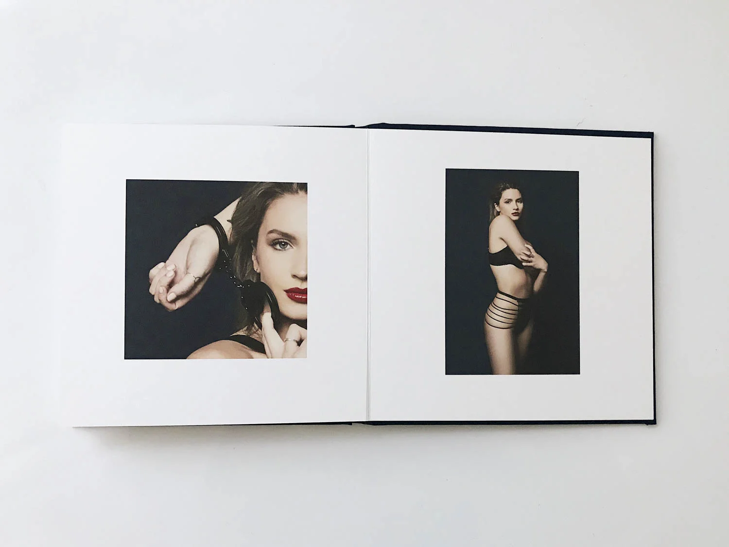 sneak preview of boudoir album of model with handcuffs
