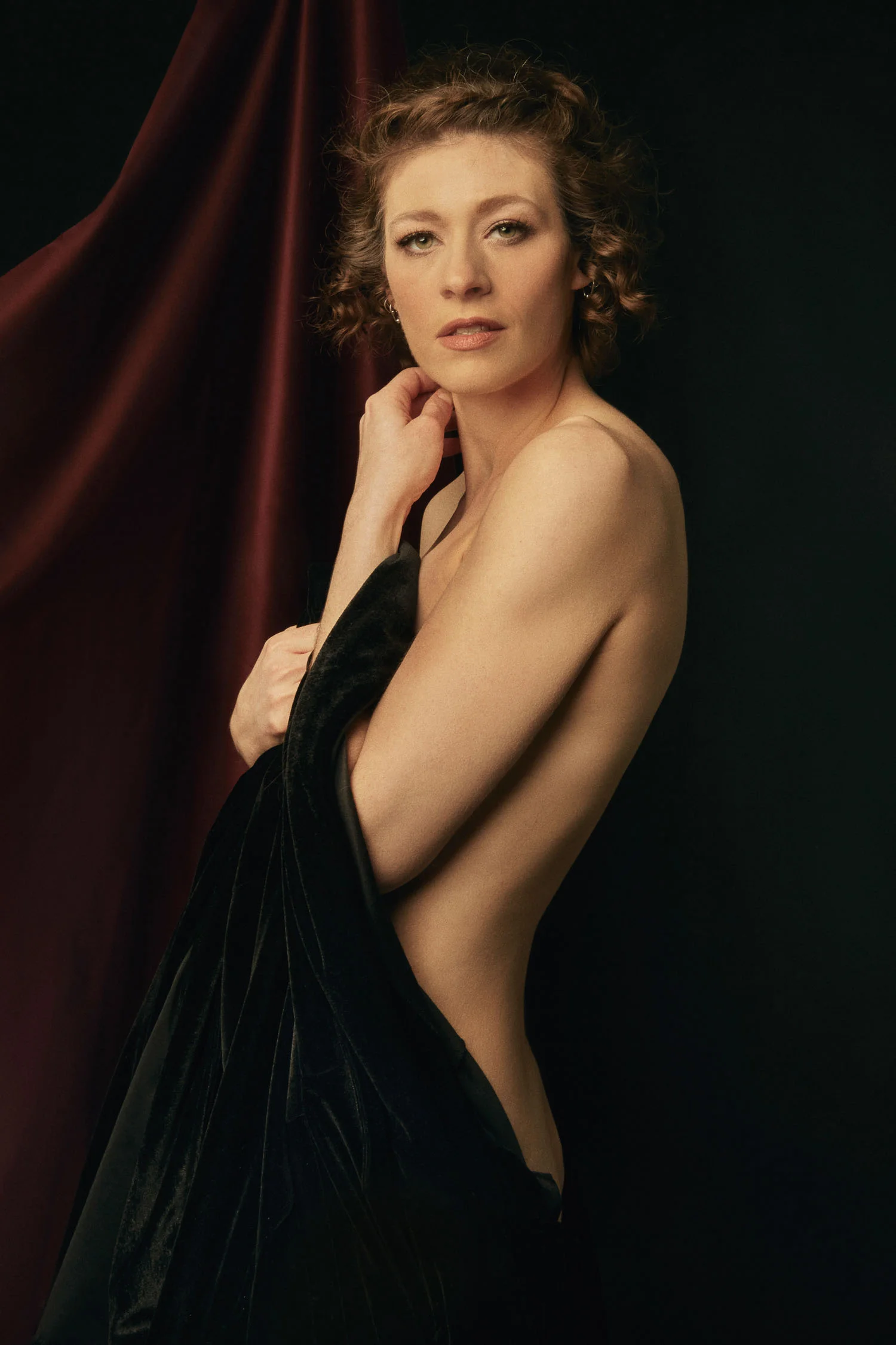 Renaissance boudoir portrait of a woman in velvet