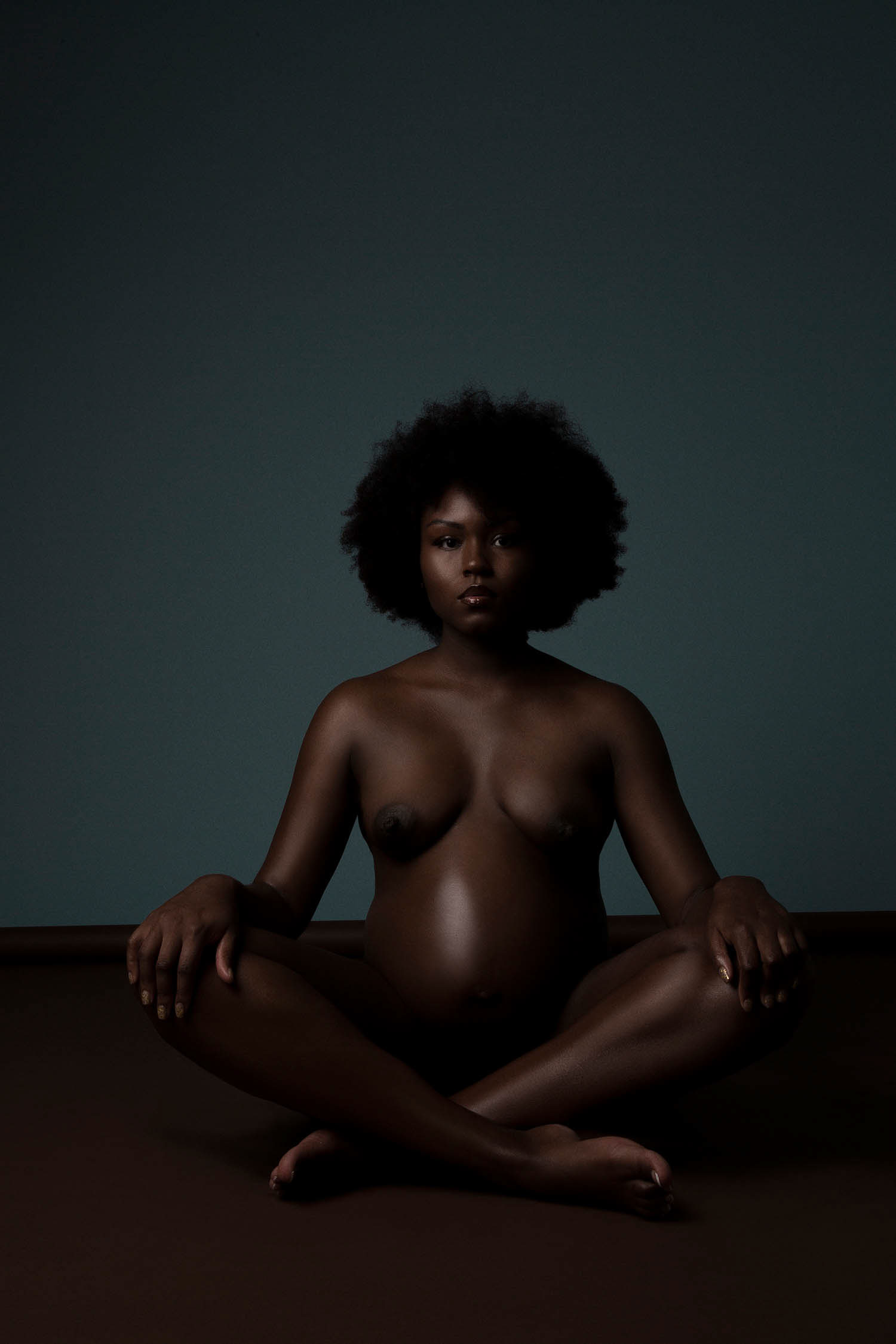 Maternity model posing sitting down