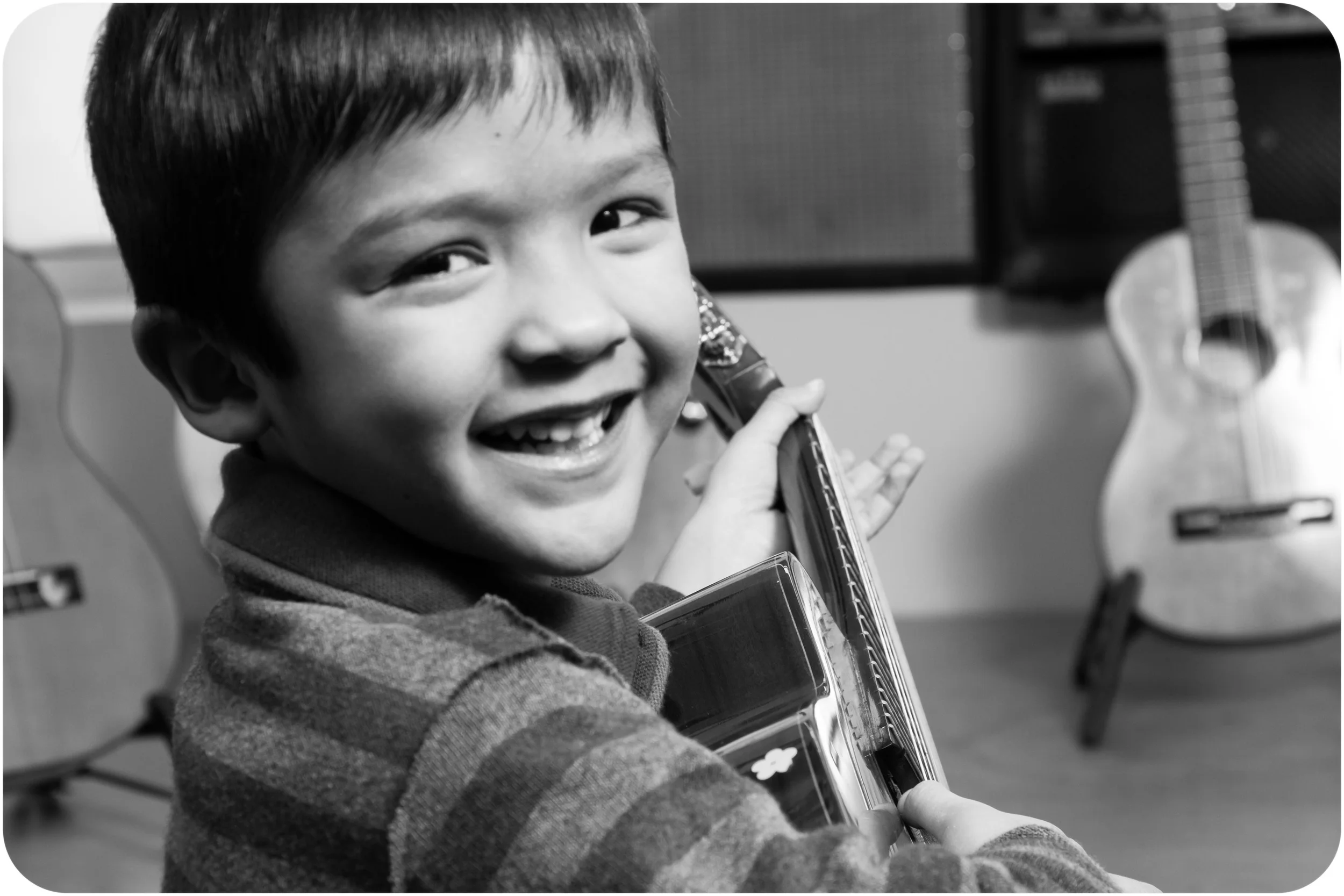 Noah's first guitar lesson.
