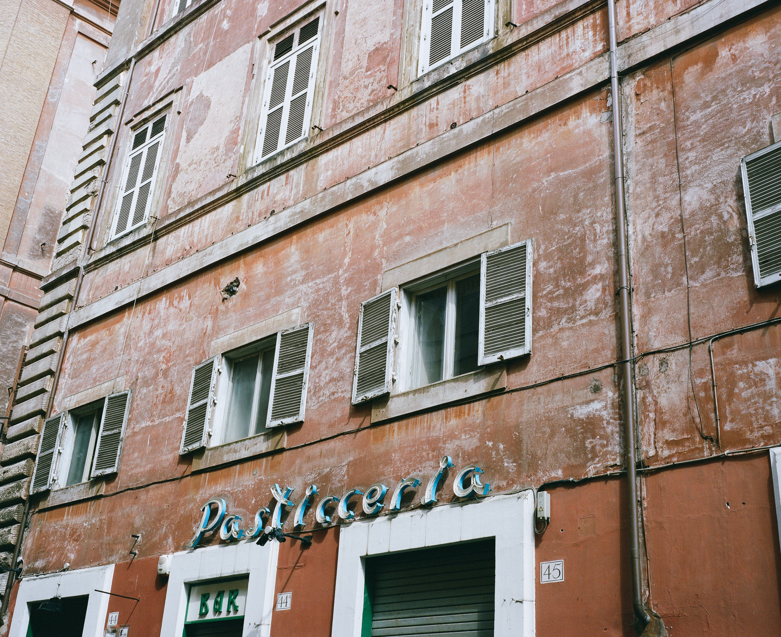 Pasticeria sign on a pink building, Rome, Italy