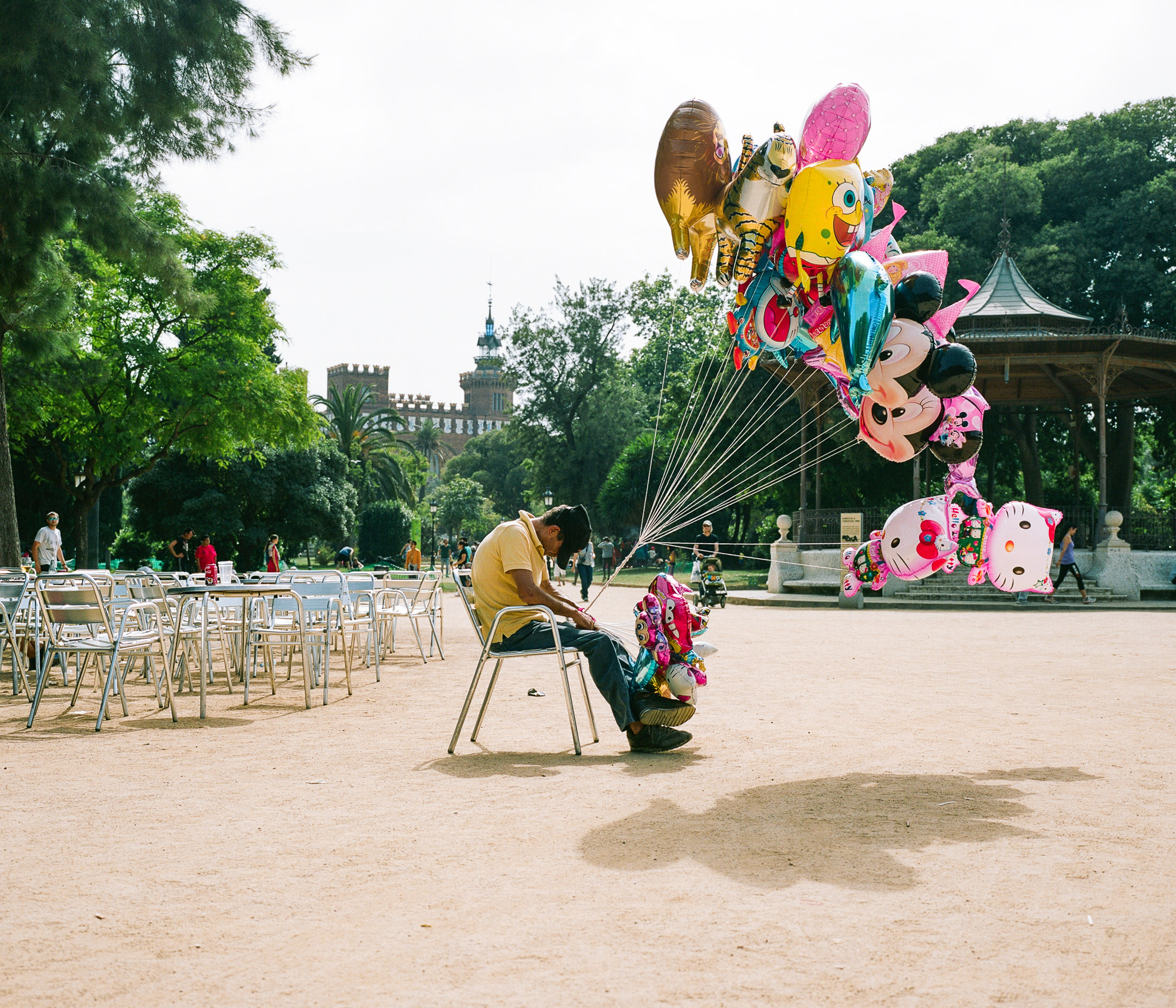 Baloon man asleep in the park in Barcelona, Spain
