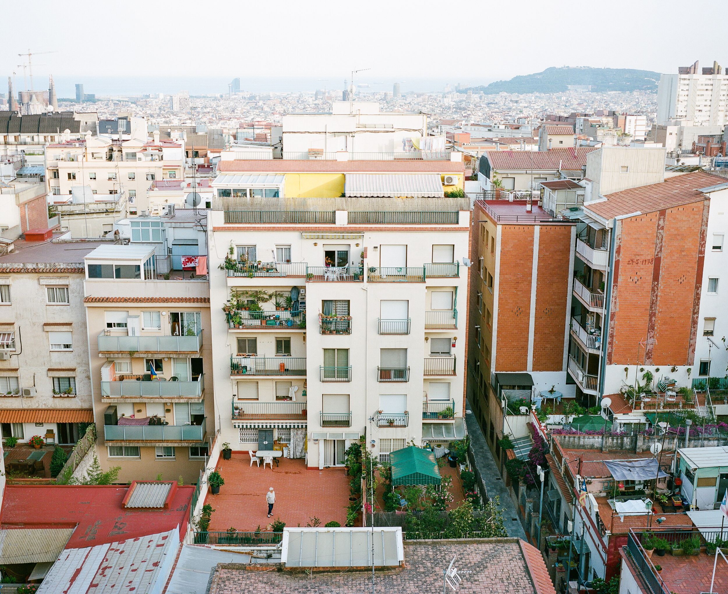 Rooftop view in Barcelona, Spain- Man on rooftop