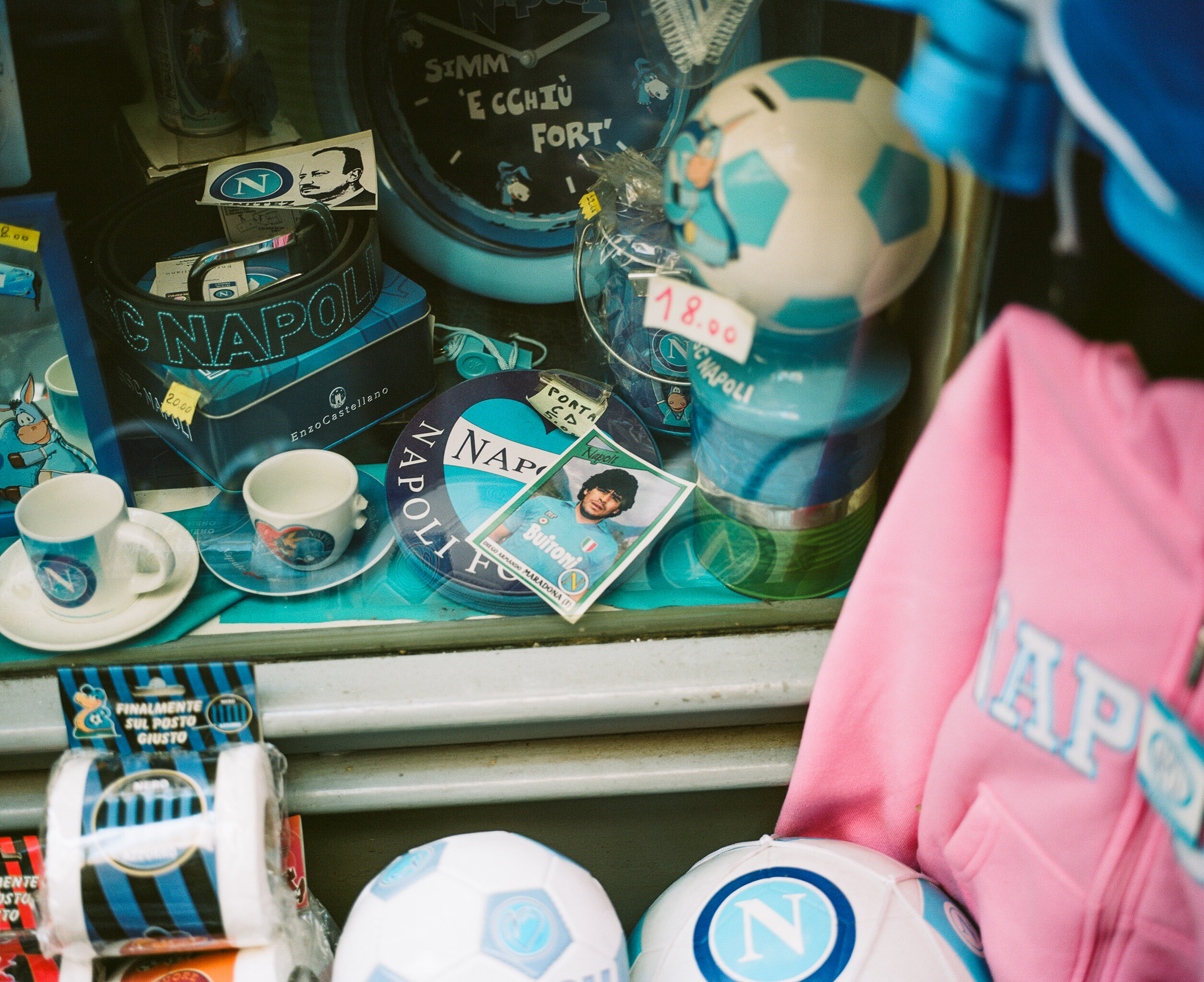 Maradona card and other sports paraphinalia in a window in Naples, Italy