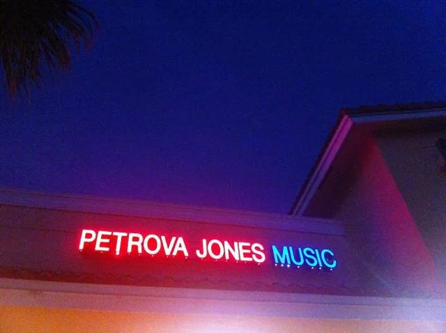 SIGN OUT FRONT:) BY NIGHT