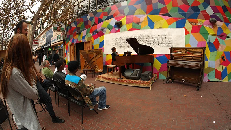 Allison Lovejoy and the growing crowd at our Market St. spot between 6th and 7th. liberated piano on left and prepared piano to the right.