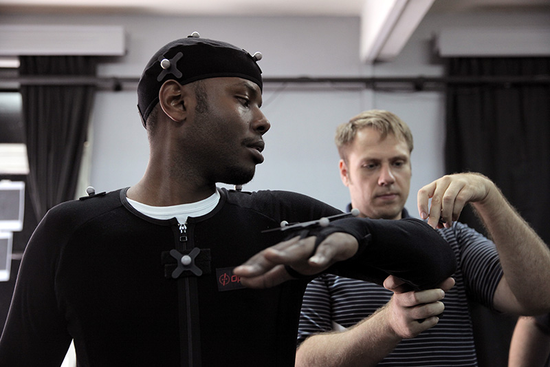 ADMA instructor Ryan Yewell places markers on student Patrick Ndaruhutse.